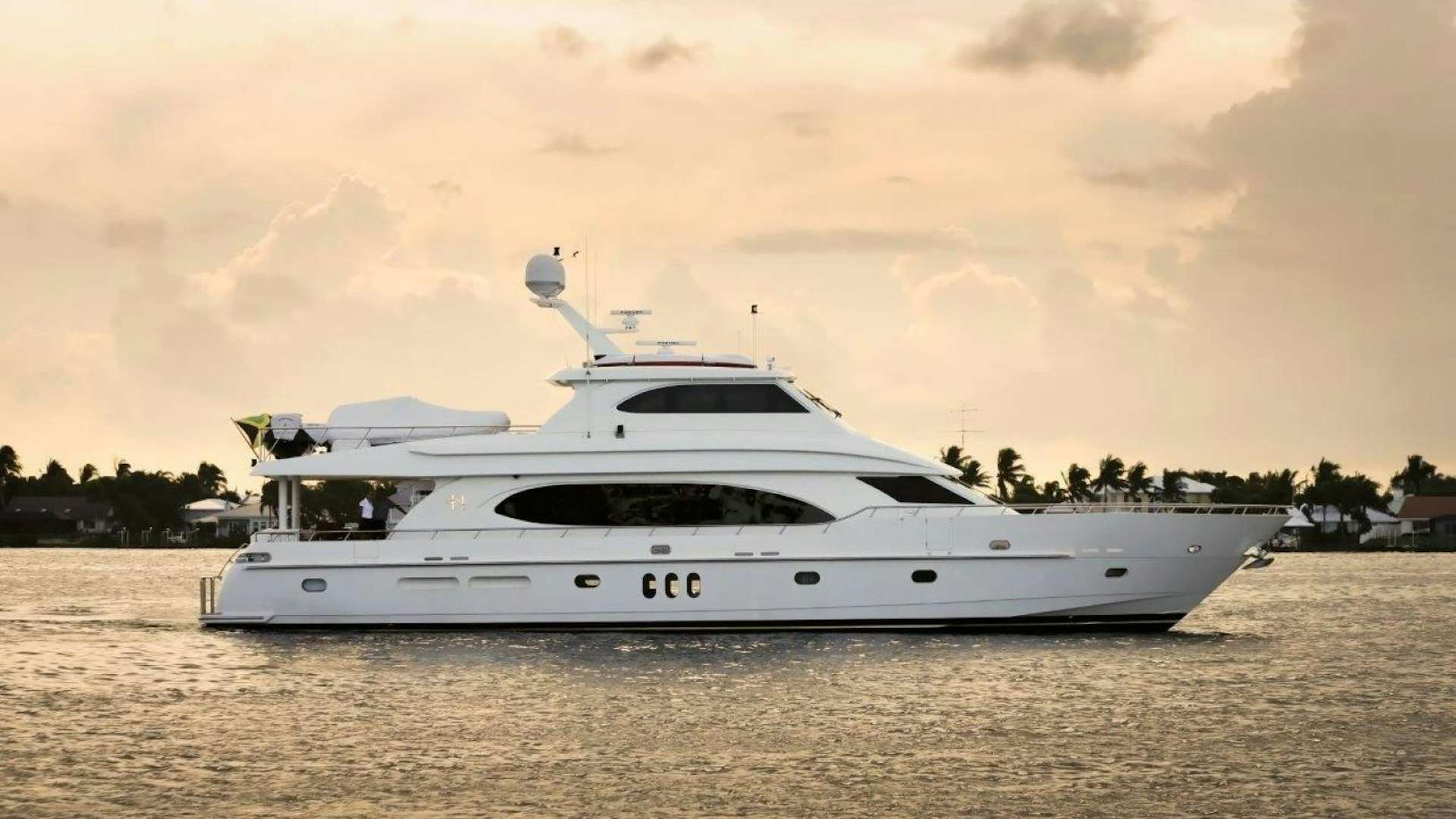a white yacht on the water aboard HEARTBEAT Yacht for Sale