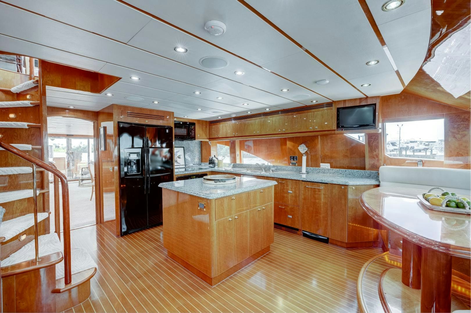 a kitchen with wooden cabinets aboard TEE TIME Yacht for Sale