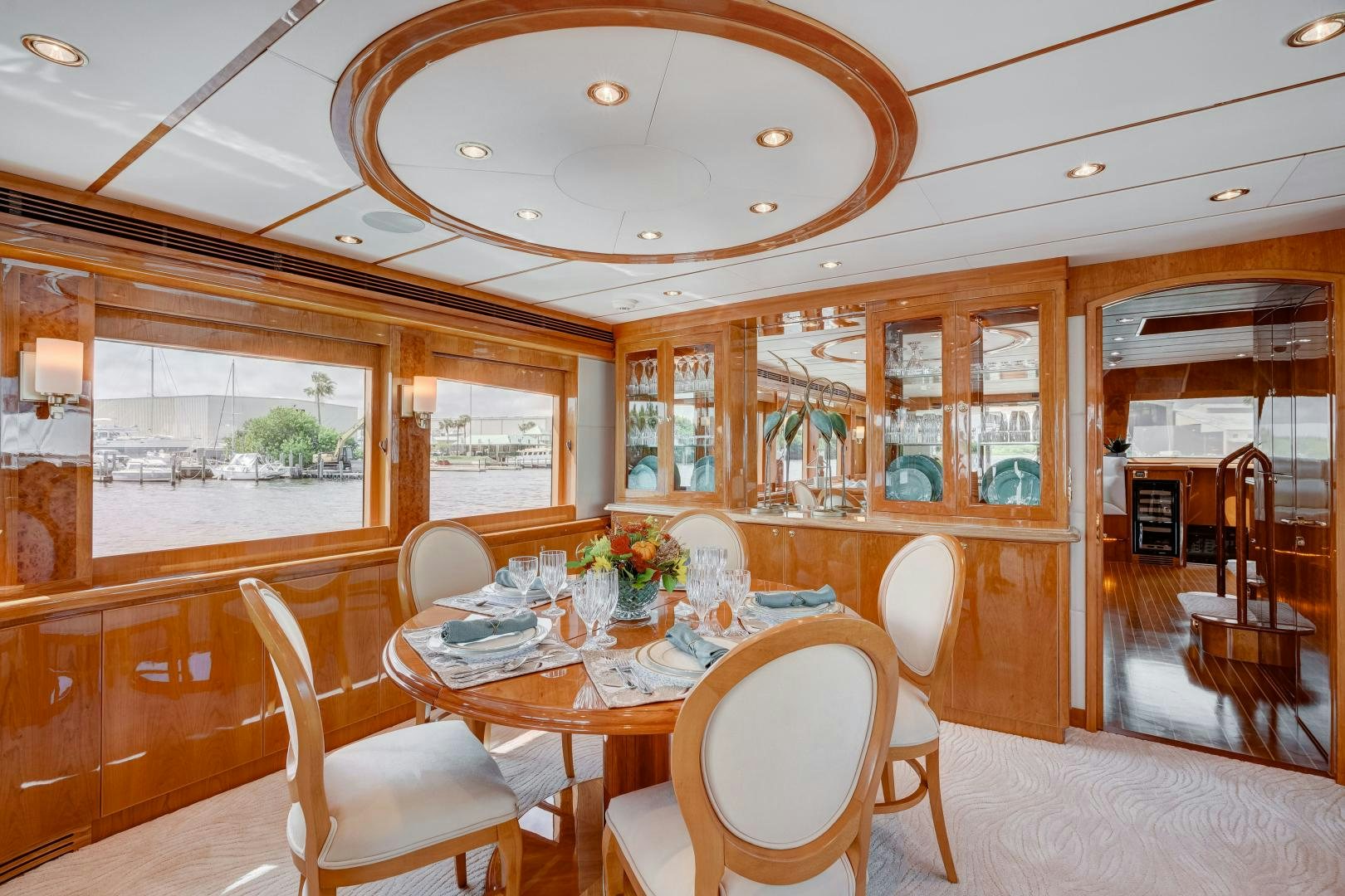 a dining room with a table and chairs aboard TEE TIME Yacht for Sale
