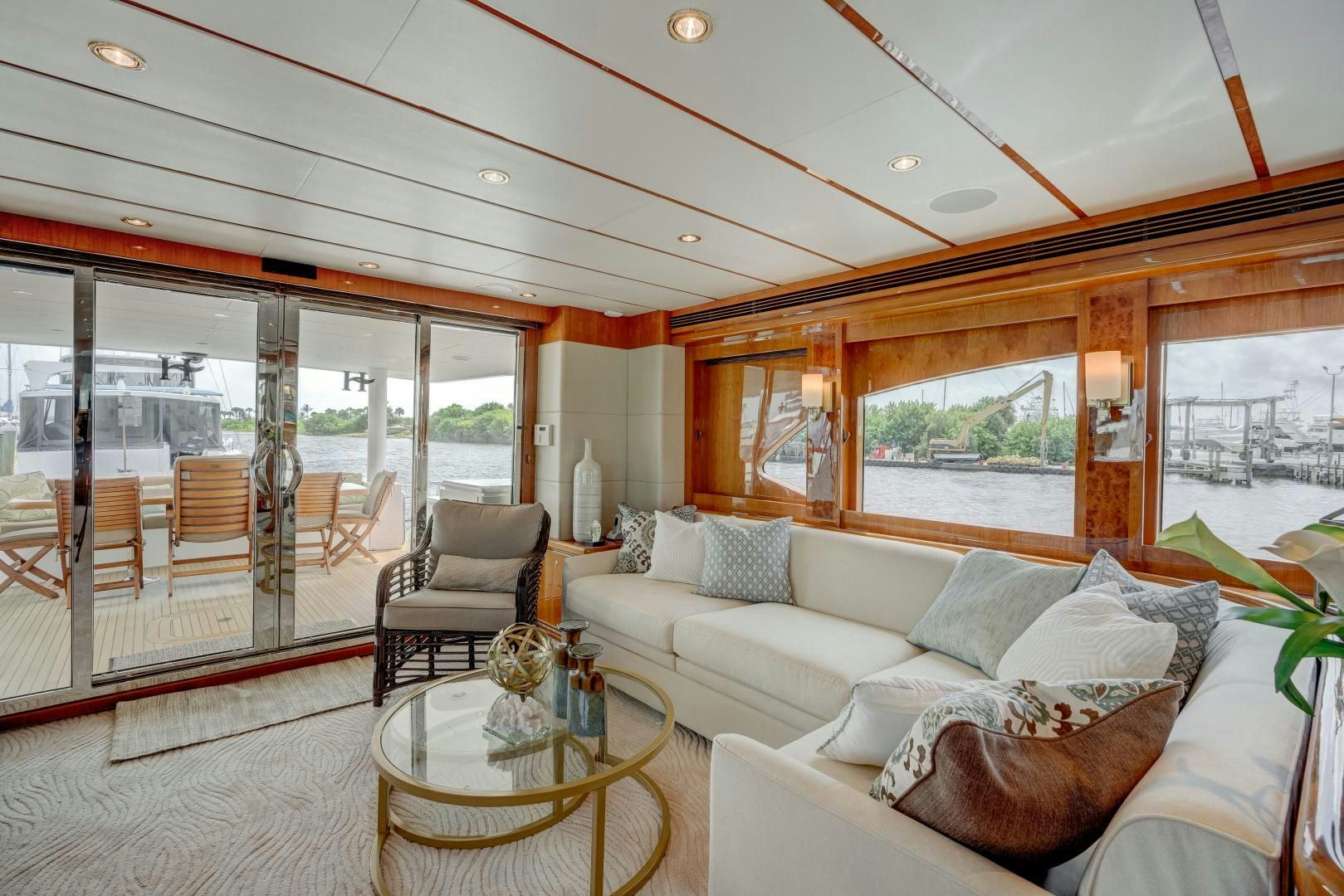 a living room with a large glass door aboard TEE TIME Yacht for Sale