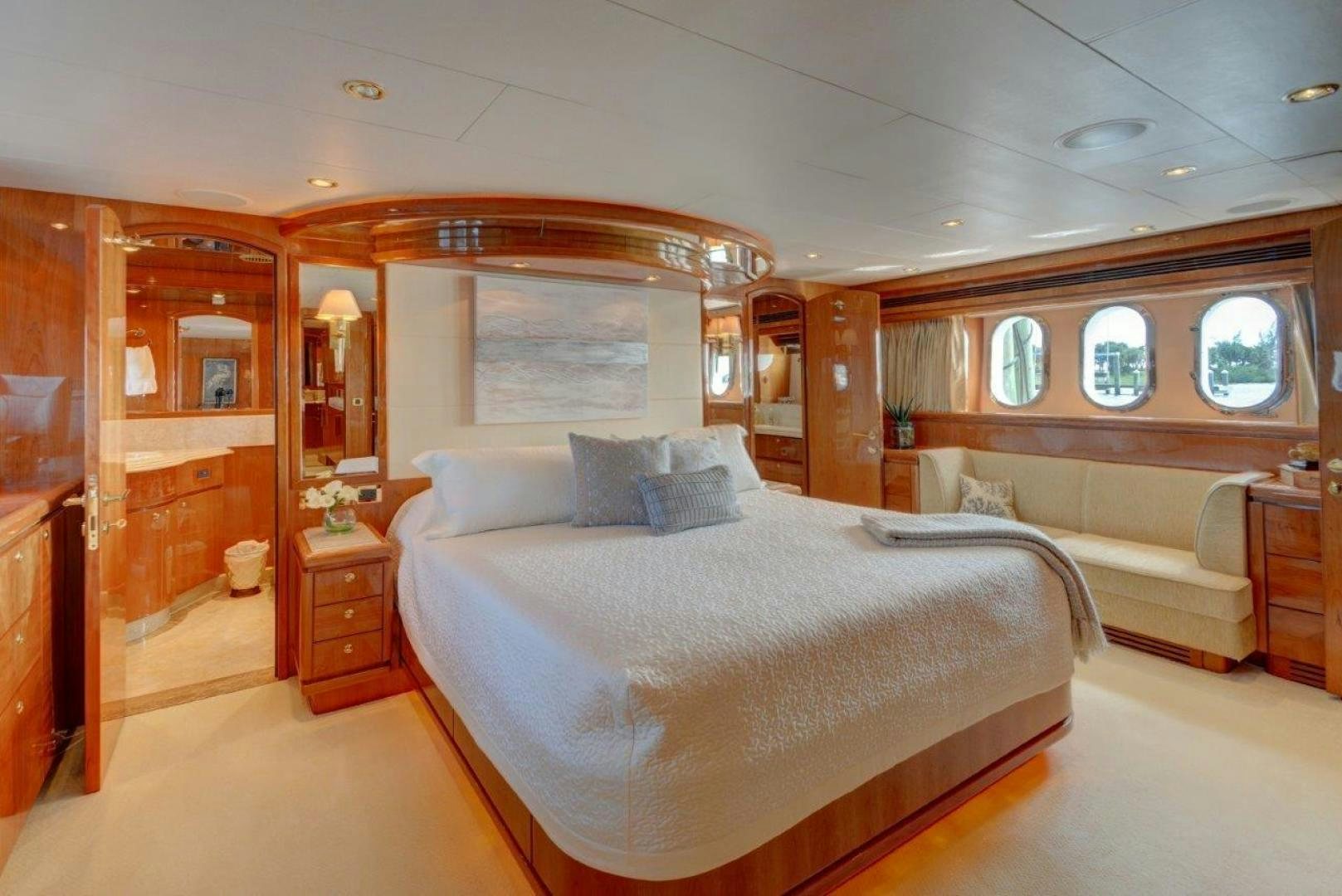 a room with a bed and a mirror aboard TEE TIME Yacht for Sale