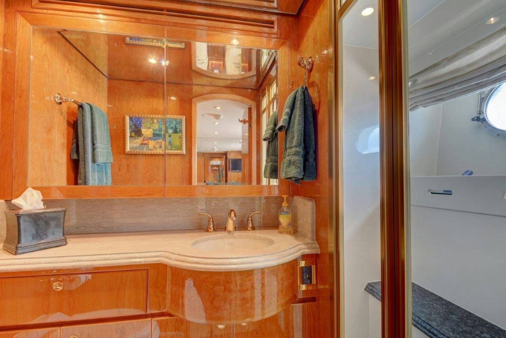 a bathroom with a large mirror aboard TEE TIME Yacht for Sale