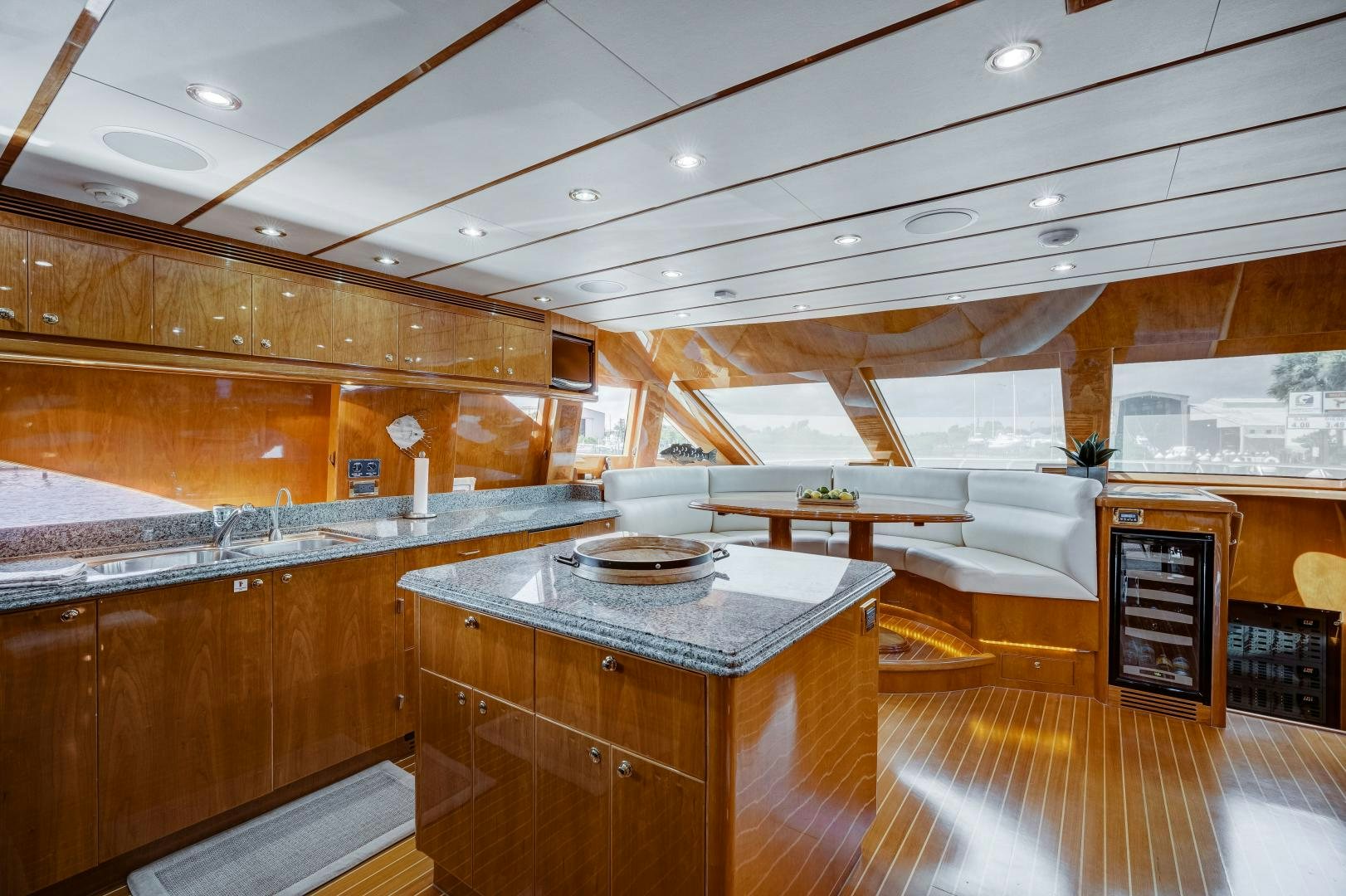 a large kitchen with wooden cabinets aboard TEE TIME Yacht for Sale