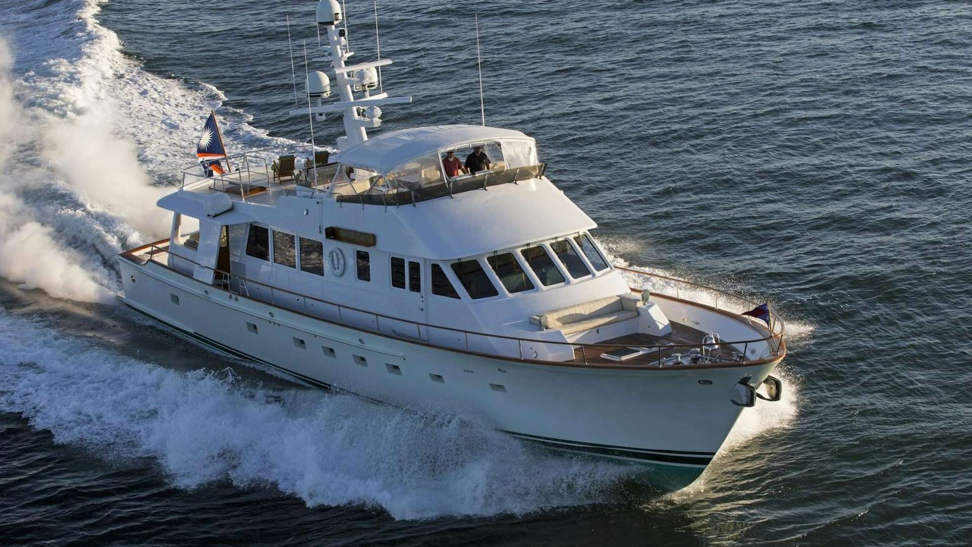 a boat on the water aboard CUSTOM HUNT 90’ Yacht for Sale