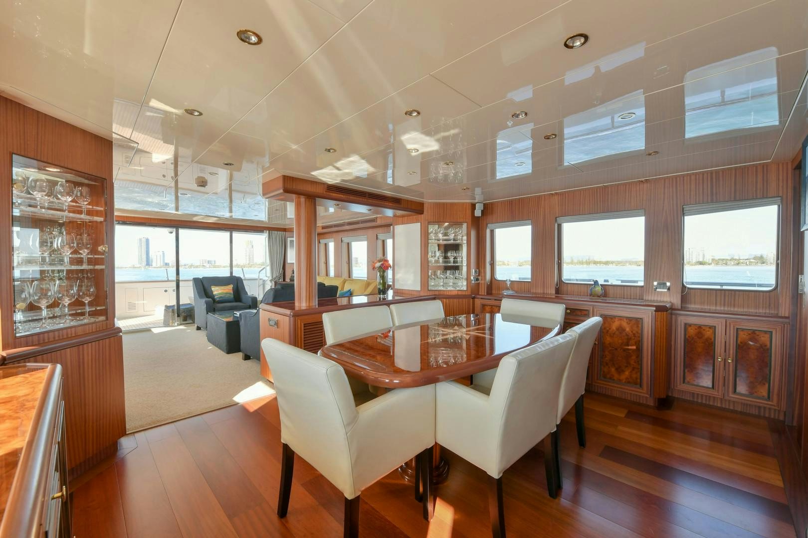 a room with a table chairs and a window aboard LITTLE BLUE Yacht for Sale