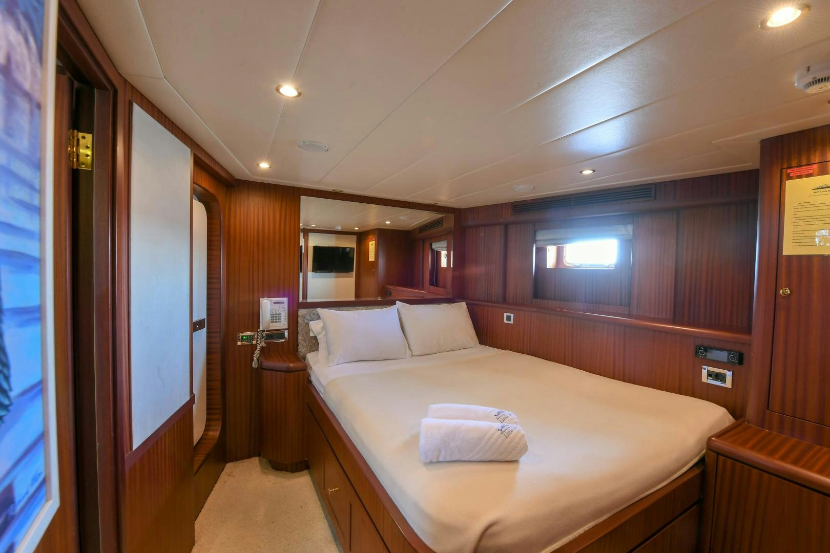 a bed in a room aboard LITTLE BLUE Yacht for Sale