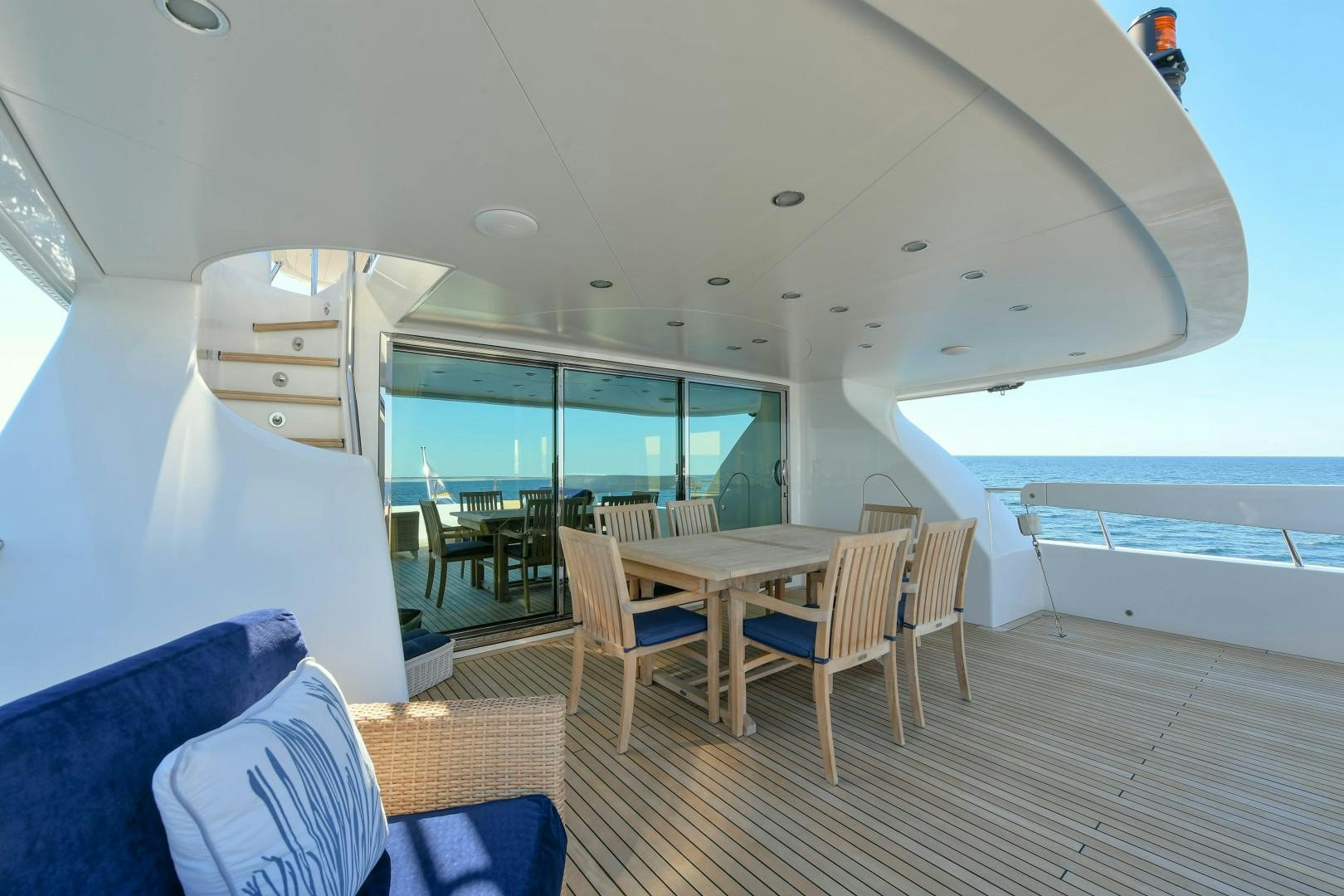 a room with a table and chairs aboard LITTLE BLUE Yacht for Sale