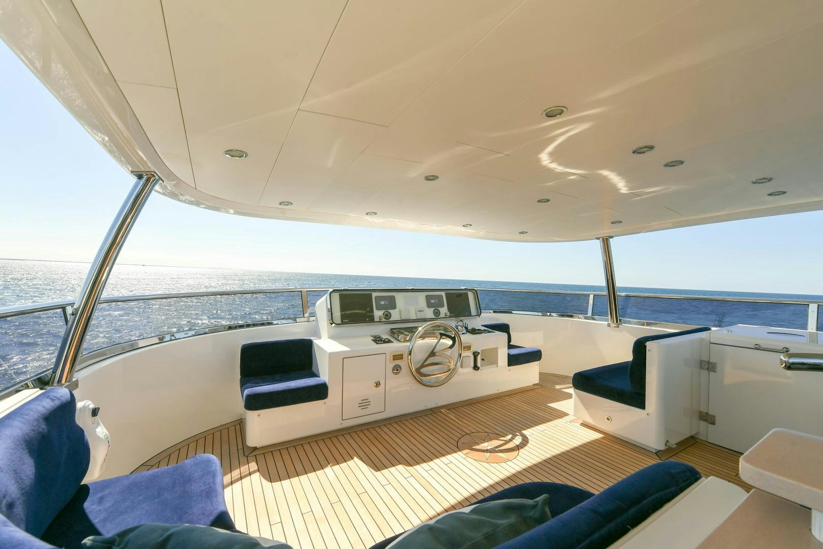 a boat with a large deck aboard LITTLE BLUE Yacht for Sale