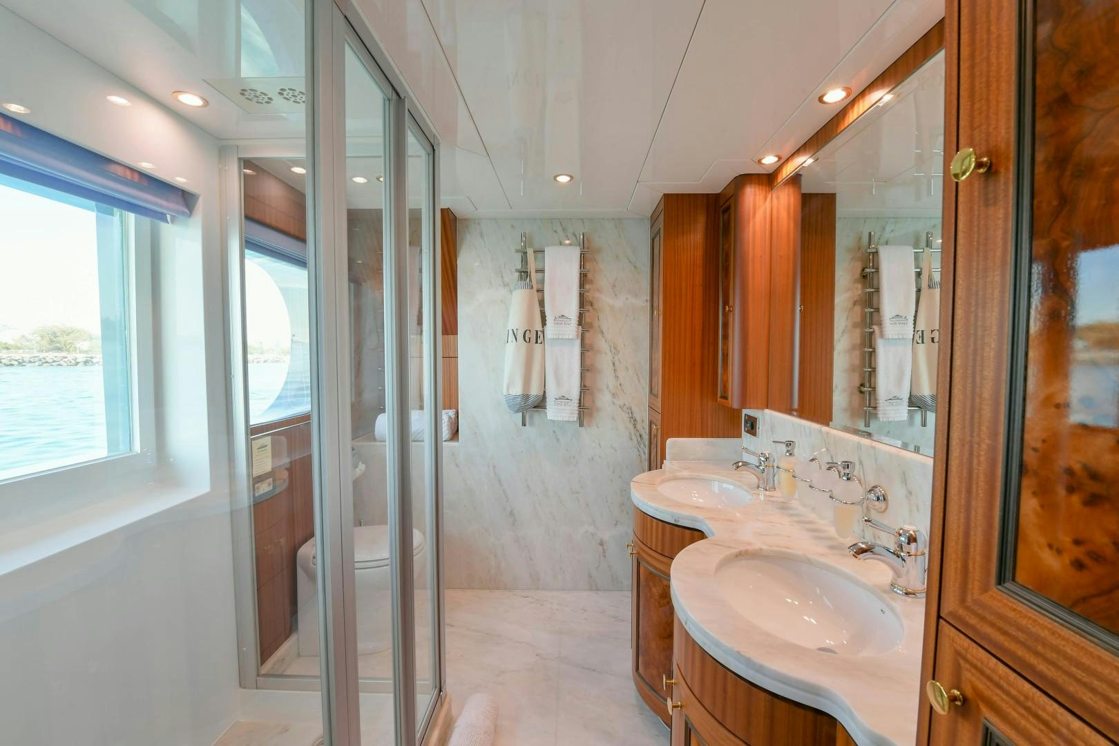 a bathroom with a sink and a shower aboard LITTLE BLUE Yacht for Sale
