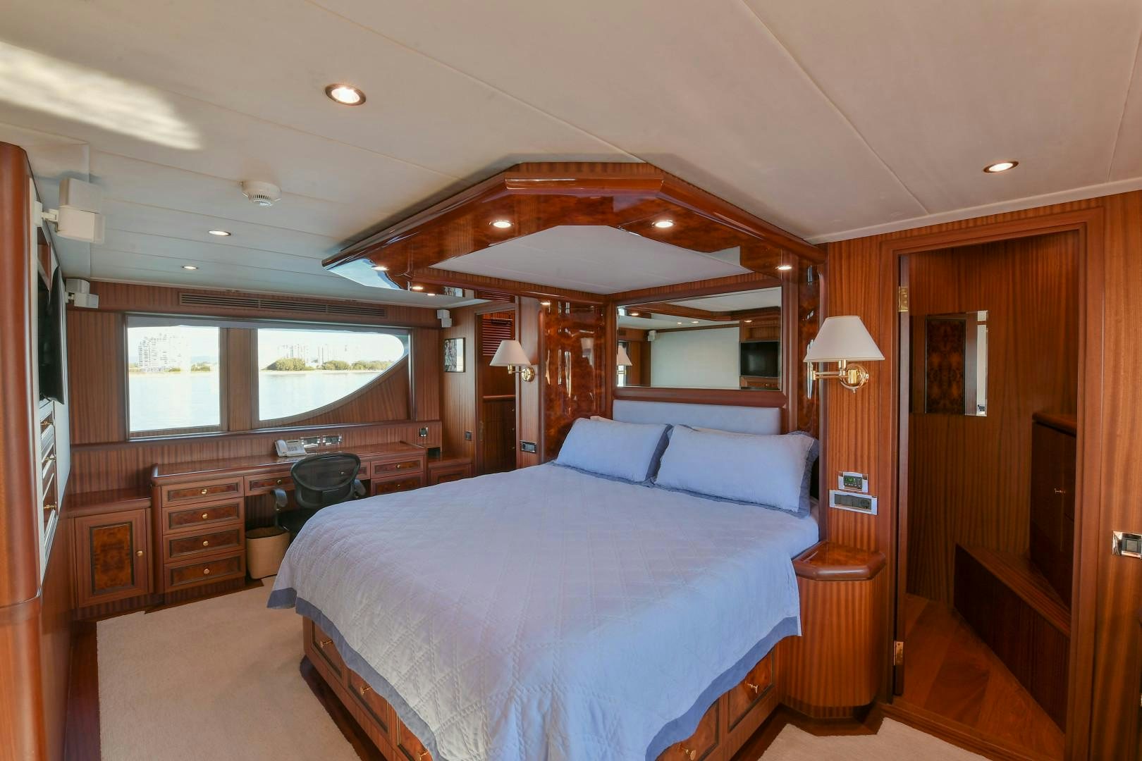 a bedroom with a large bed aboard LITTLE BLUE Yacht for Sale