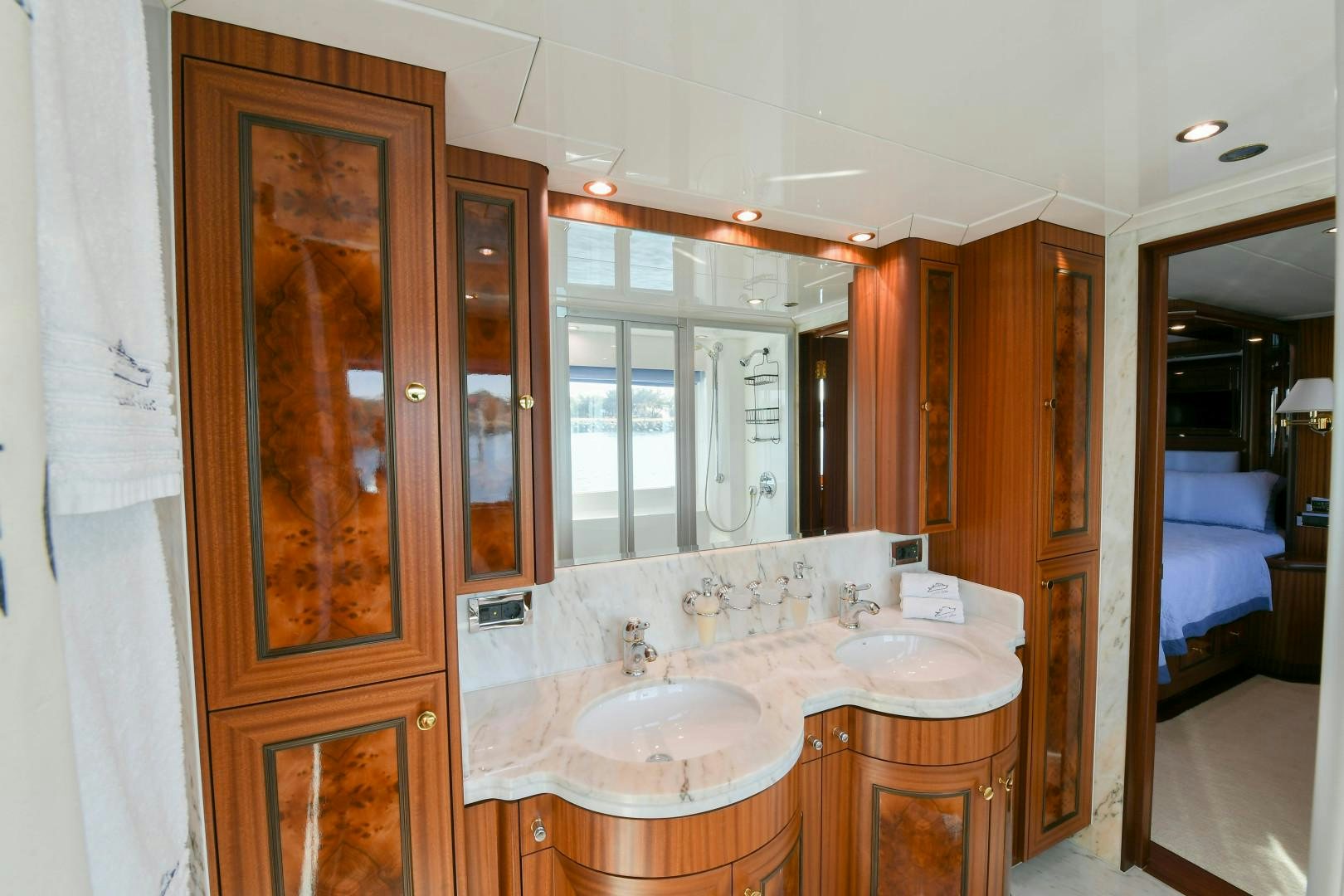 a bathroom with a sink and a mirror aboard LITTLE BLUE Yacht for Sale