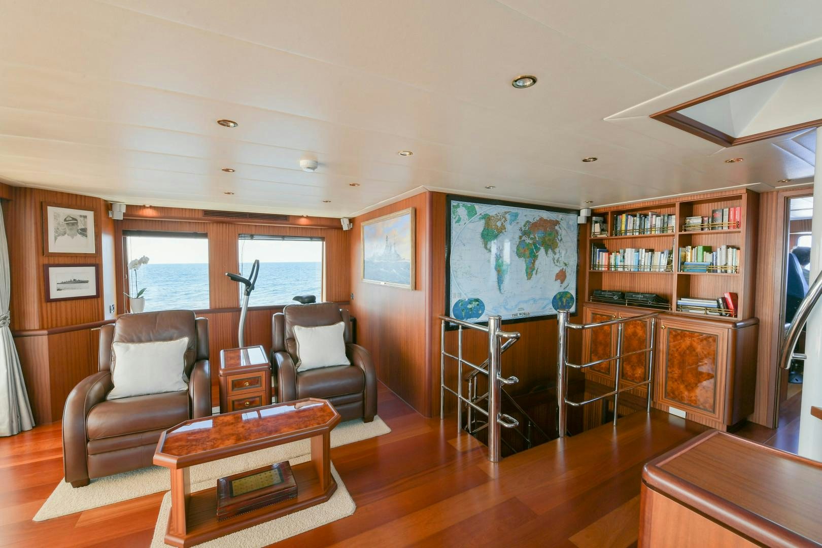 a living room with a table and chairs aboard LITTLE BLUE Yacht for Sale