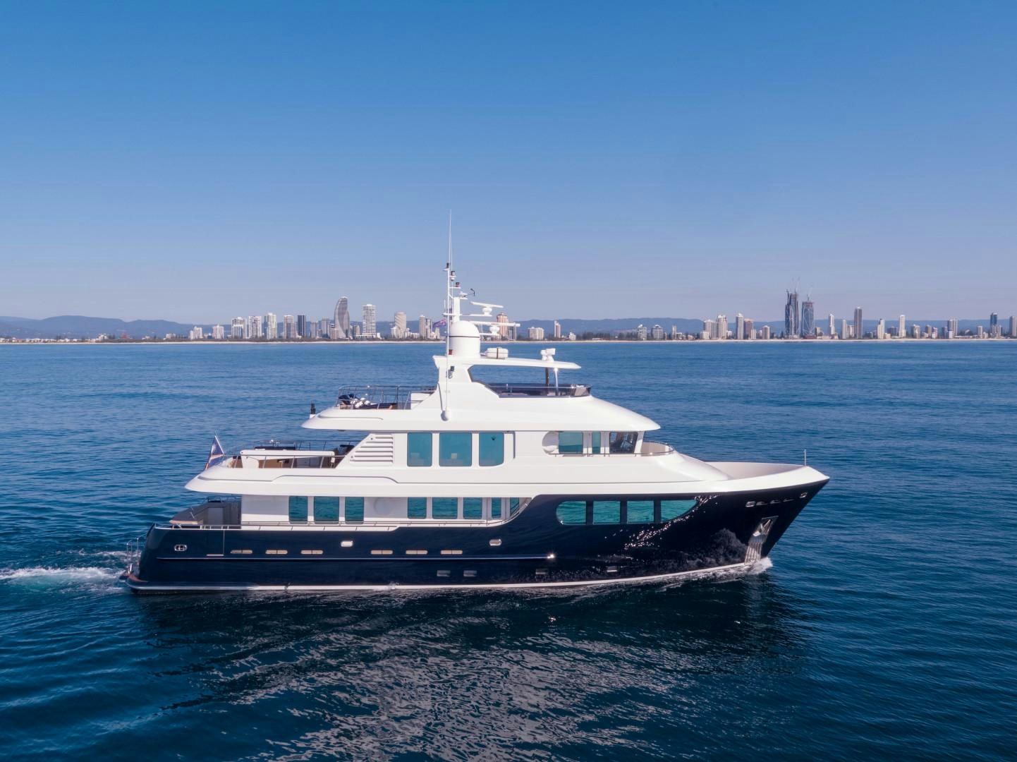 a large white boat on the water aboard LITTLE BLUE Yacht for Sale