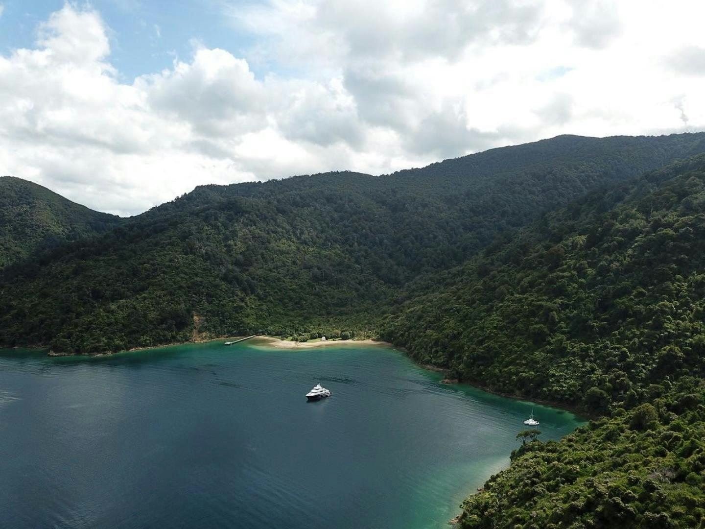 a body of water surrounded by trees aboard LITTLE BLUE Yacht for Sale