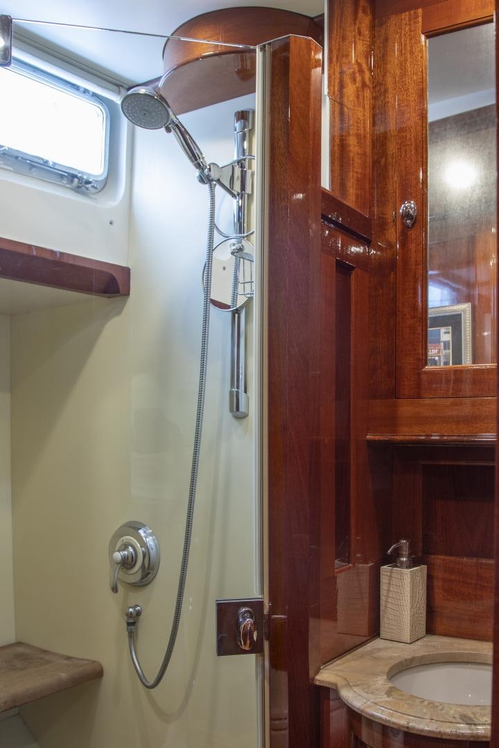 a shower with a sink and a mirror aboard SEA DIAMOND Yacht for Sale