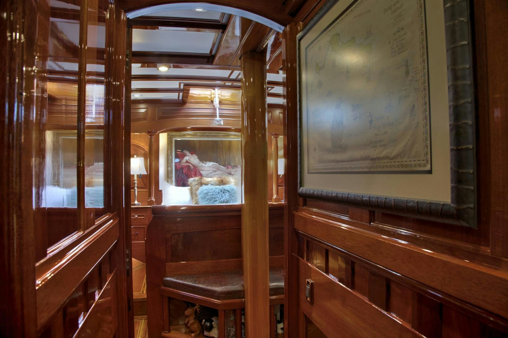 a room with wood walls and a painting on the wall aboard SEA DIAMOND Yacht for Sale