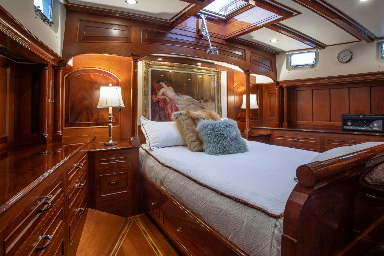 a bed with a white comforter aboard SEA DIAMOND Yacht for Sale