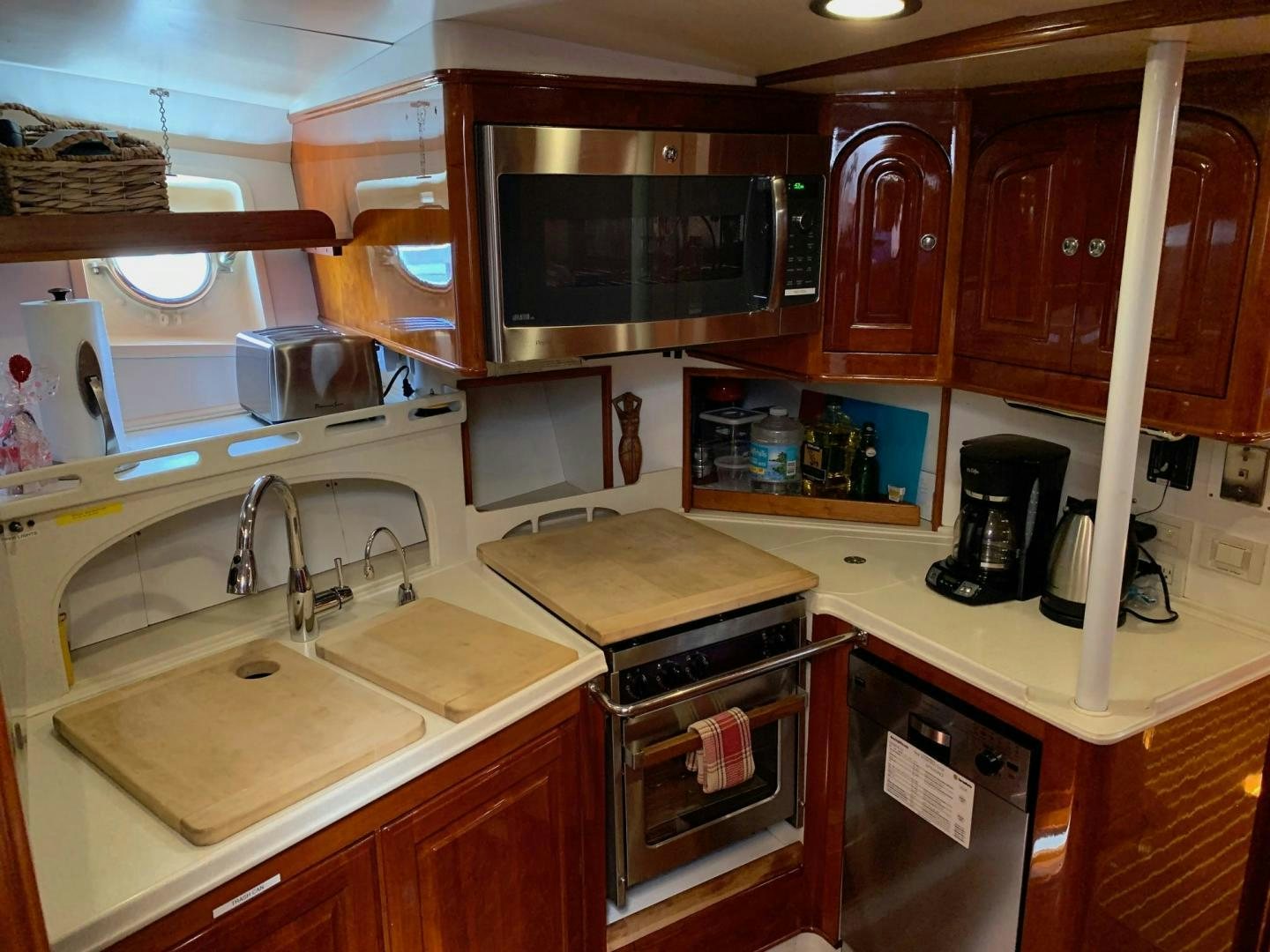 a kitchen with wooden cabinets aboard SEA DIAMOND Yacht for Sale