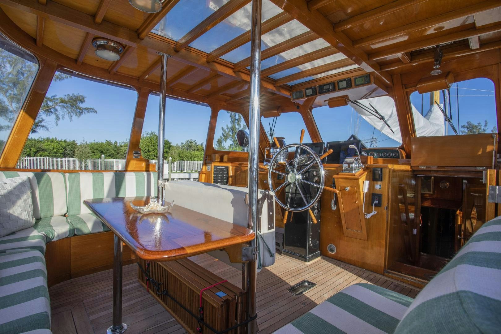 a boat with a table and chairs aboard SEA DIAMOND Yacht for Sale