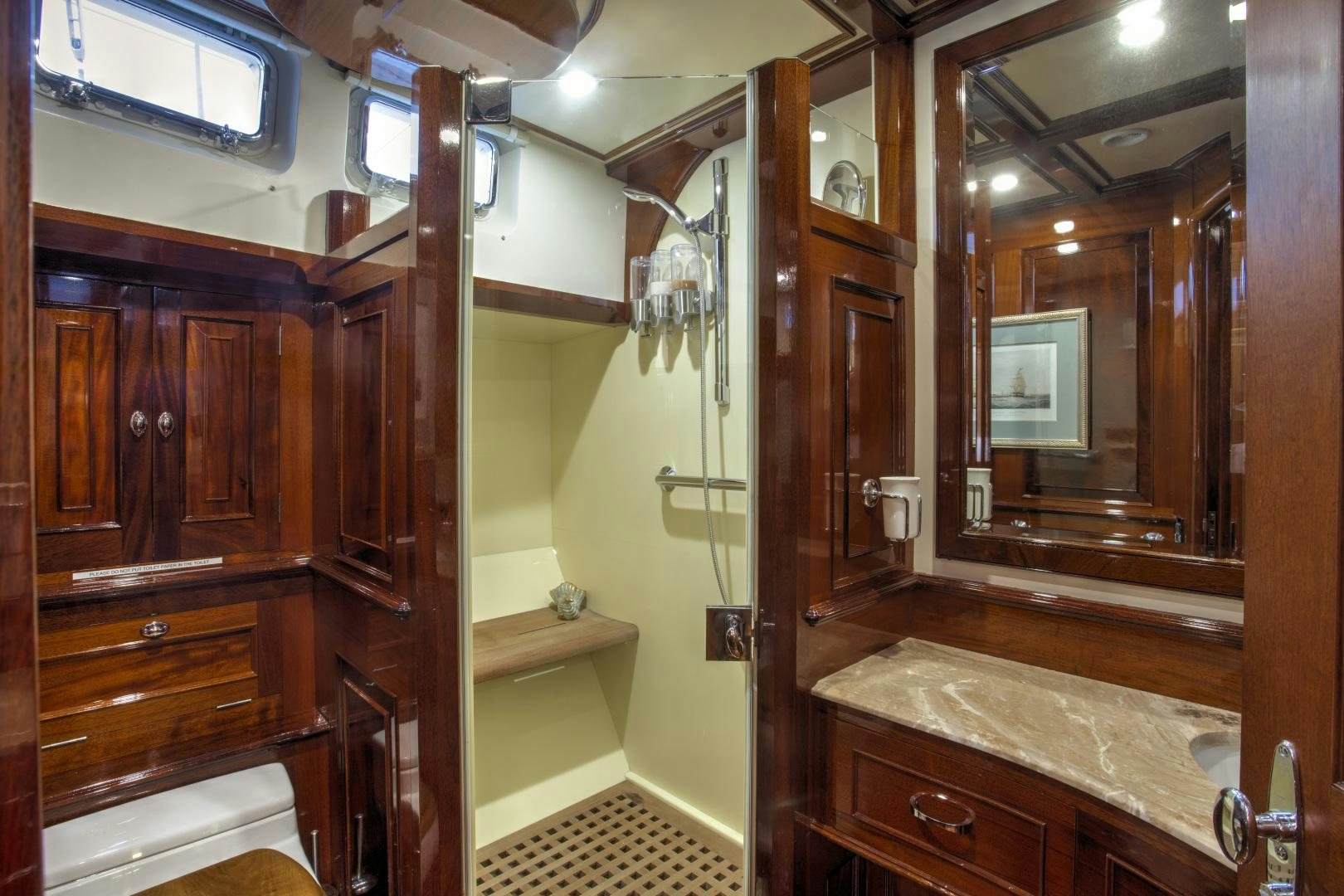 a bathroom with a large mirror aboard SEA DIAMOND Yacht for Sale