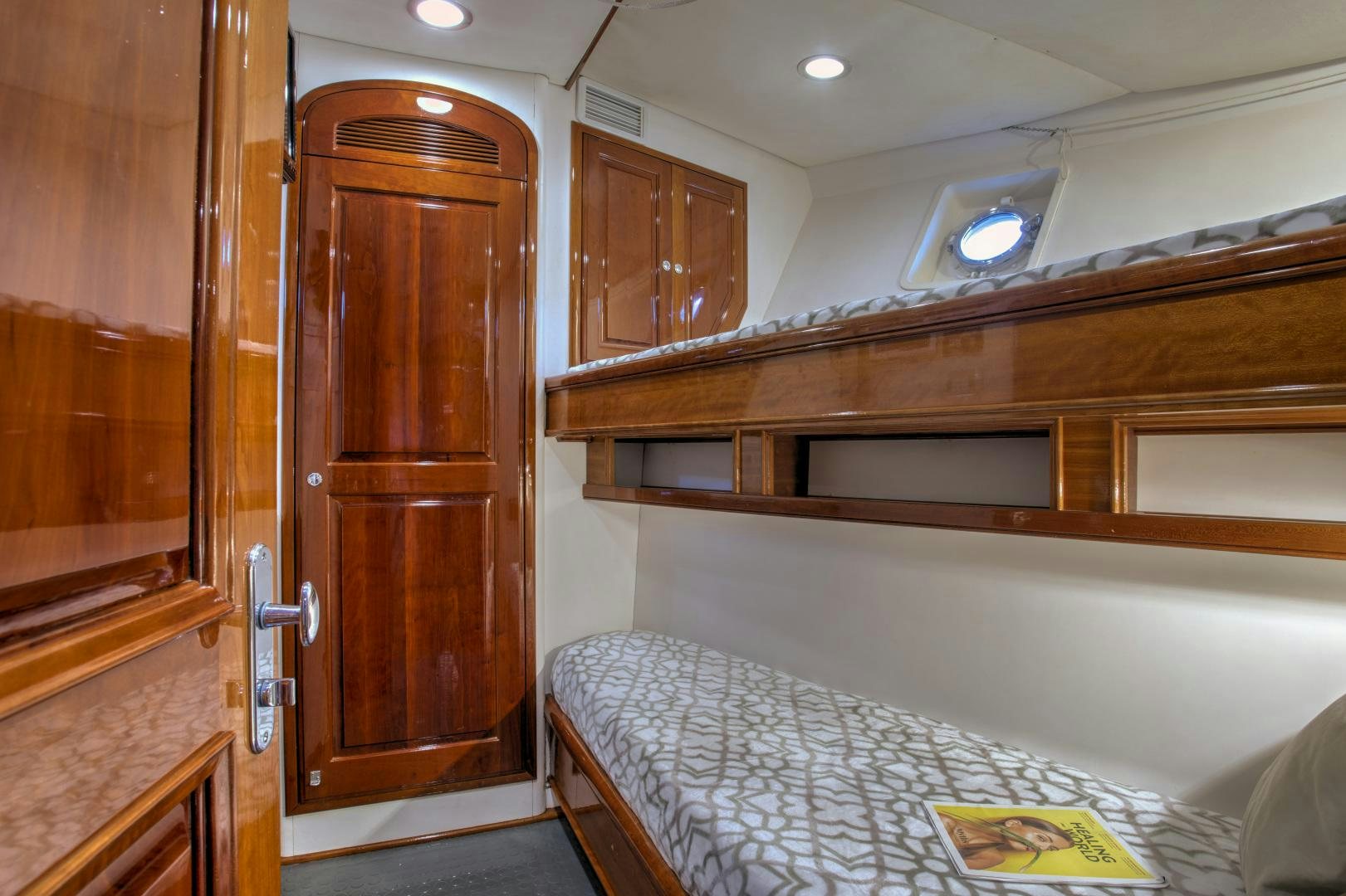 a bedroom with a bed and a closet aboard SEA DIAMOND Yacht for Sale