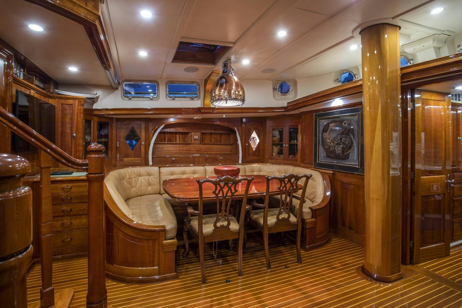 a dining room with a table and chairs aboard SEA DIAMOND Yacht for Sale