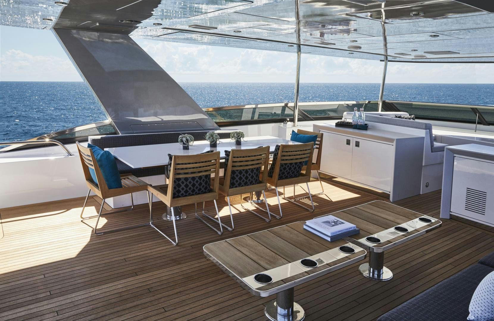 a deck with chairs and a table on it aboard 2021 NEW BUILD Yacht for Sale