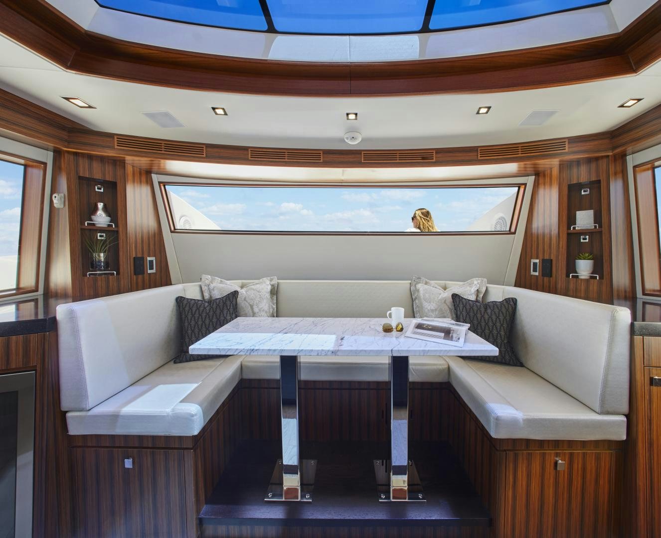 a room with a couch and a table aboard 2021 NEW BUILD Yacht for Sale