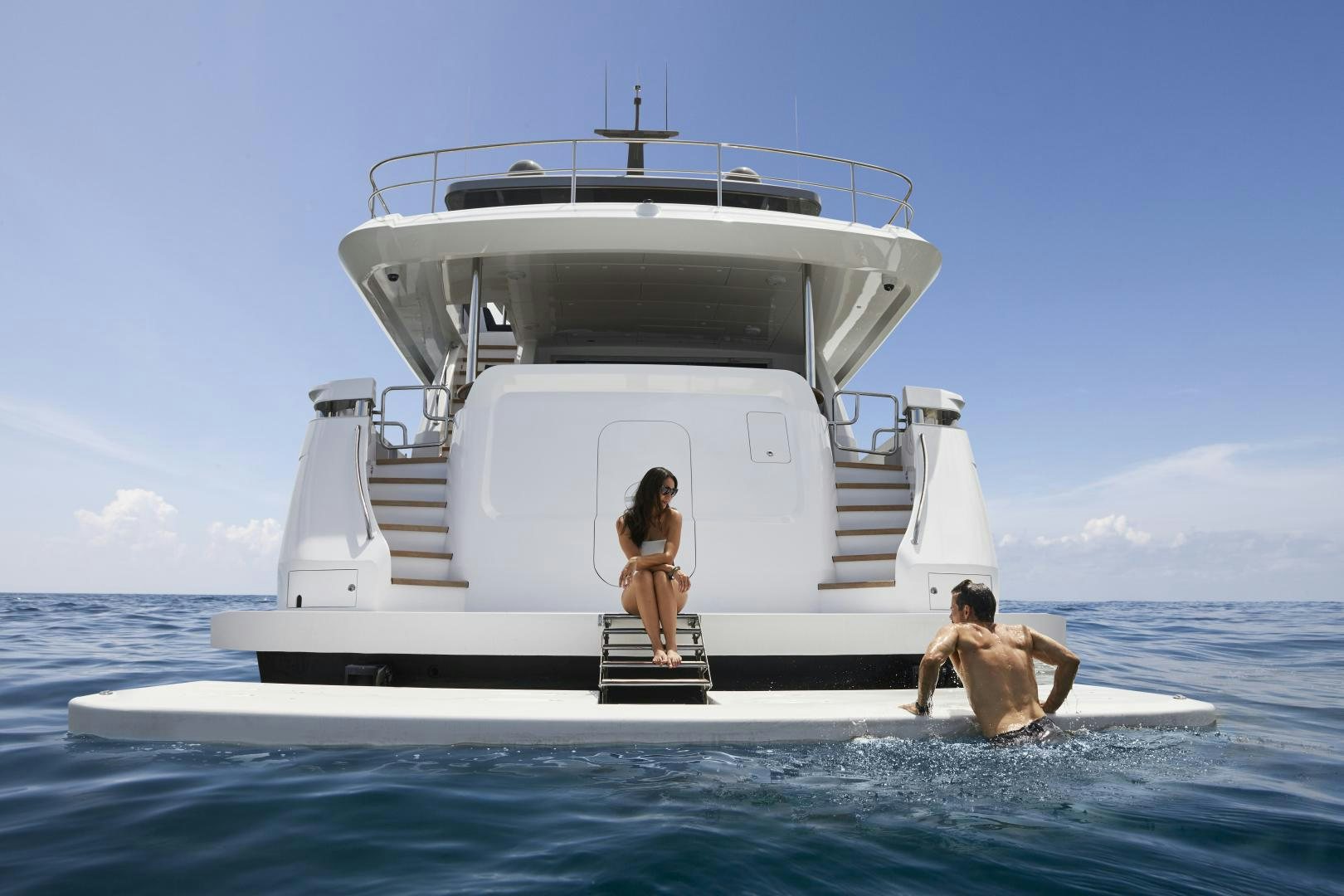 a couple of people standing on a boat in the water aboard 2021 NEW BUILD Yacht for Sale
