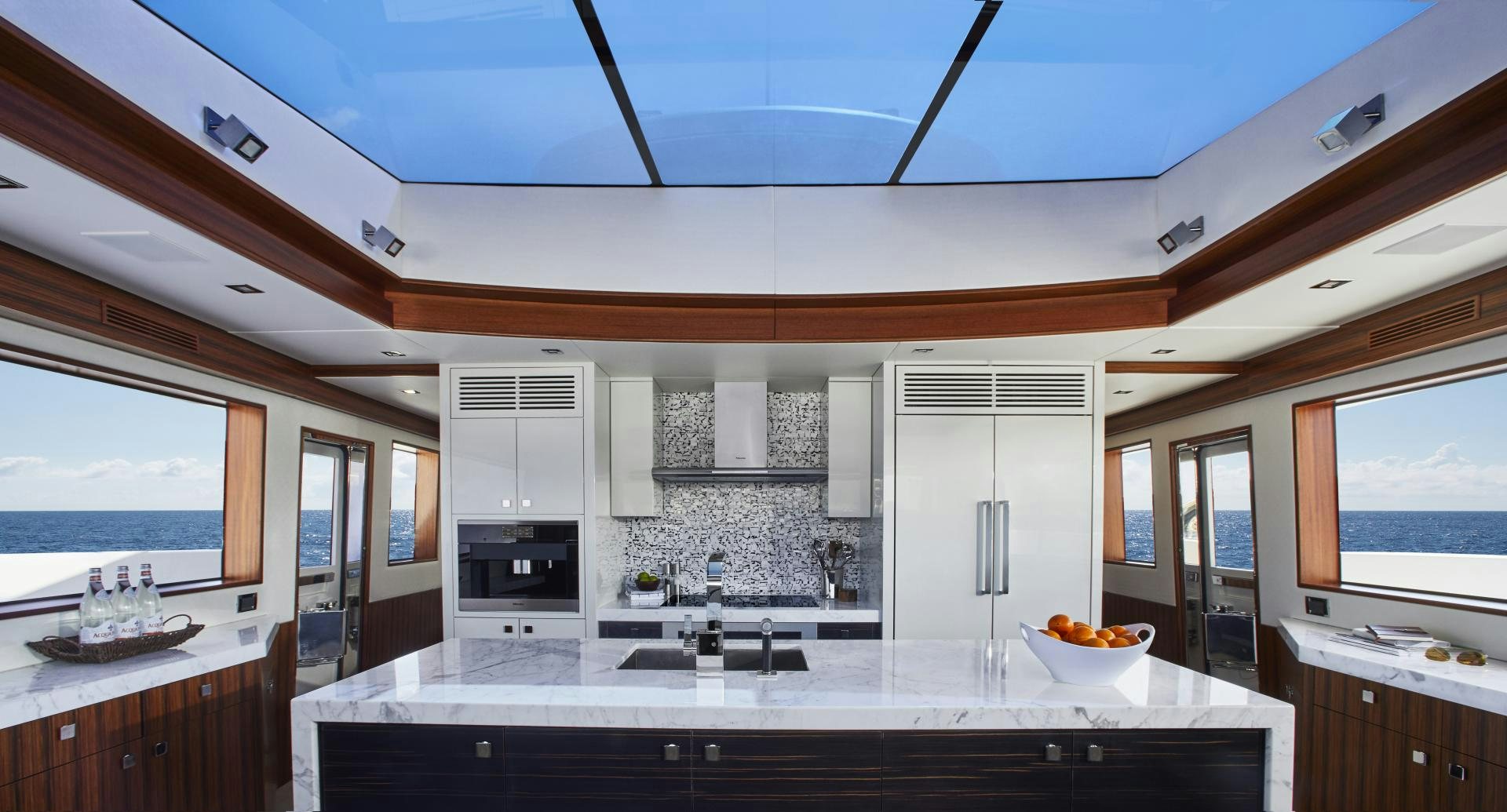 a kitchen with white cabinets aboard 2021 NEW BUILD Yacht for Sale
