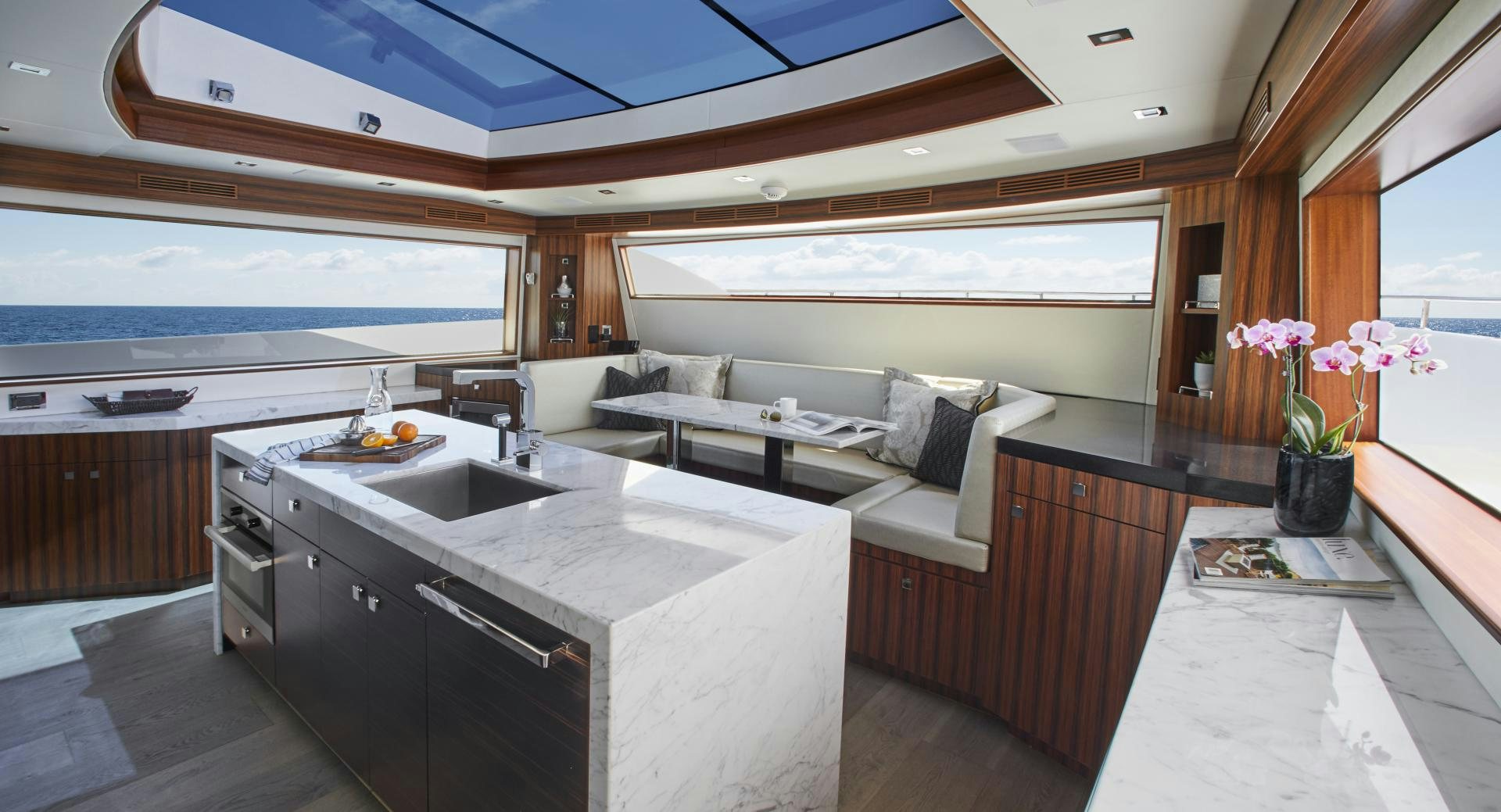 a kitchen with a couch and a sink aboard 2021 NEW BUILD Yacht for Sale