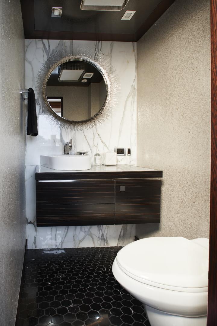 a bathroom with a toilet and a sink aboard 2021 NEW BUILD Yacht for Sale