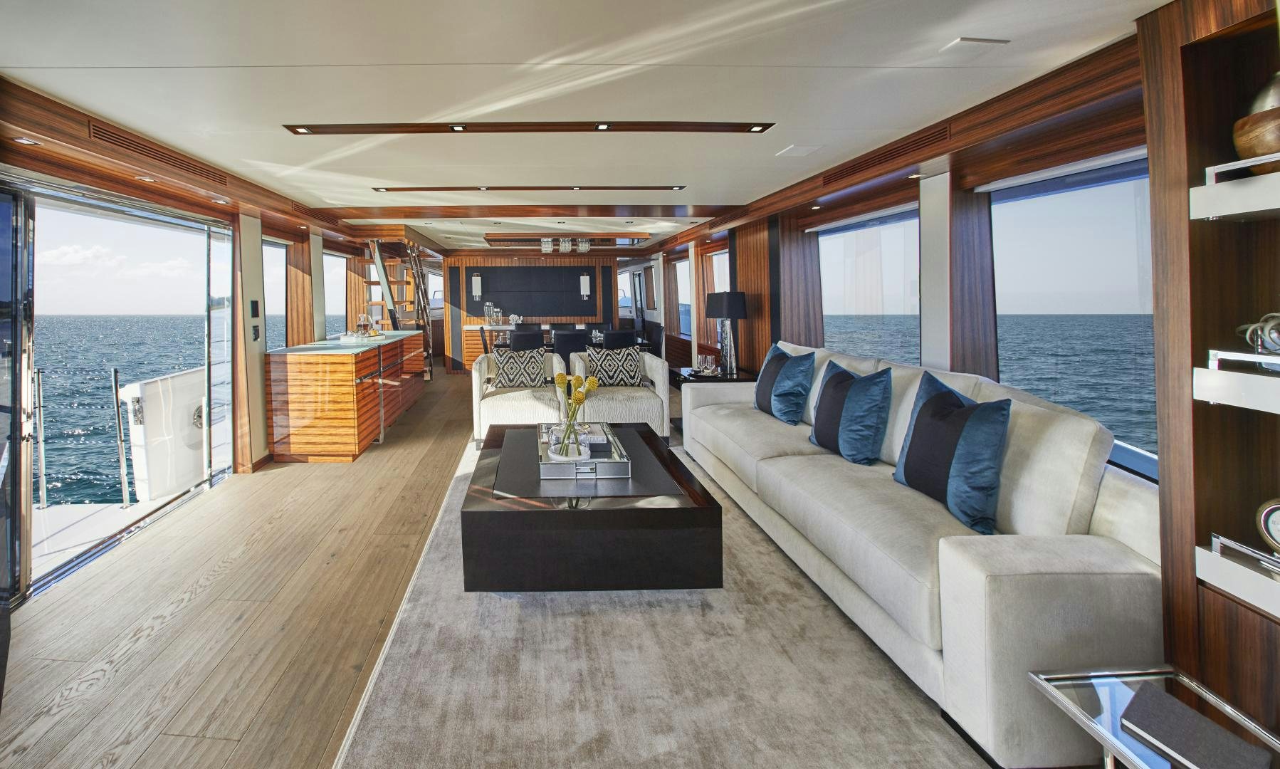 a living room with a large window aboard 2021 NEW BUILD Yacht for Sale