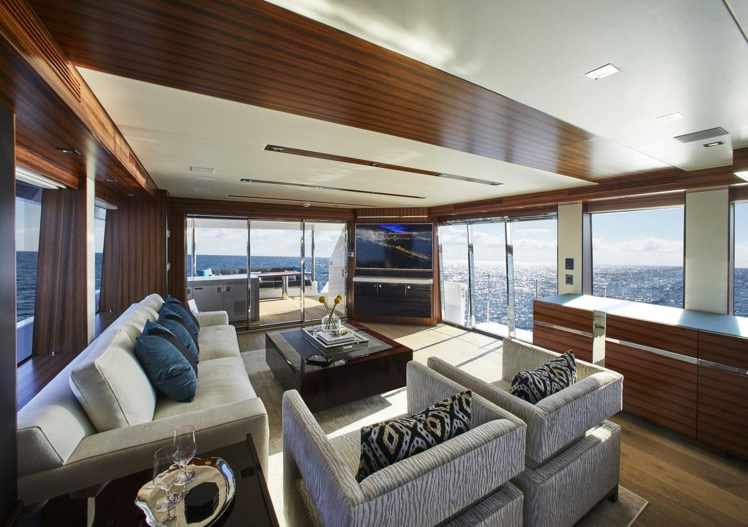 a living room with a large window aboard 2021 NEW BUILD Yacht for Sale