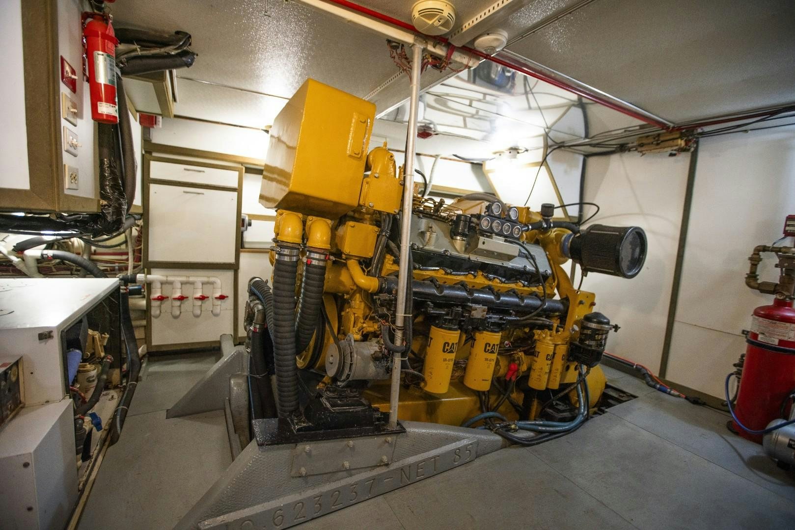 a yellow machine in a factory aboard HEMINGWAY Yacht for Sale