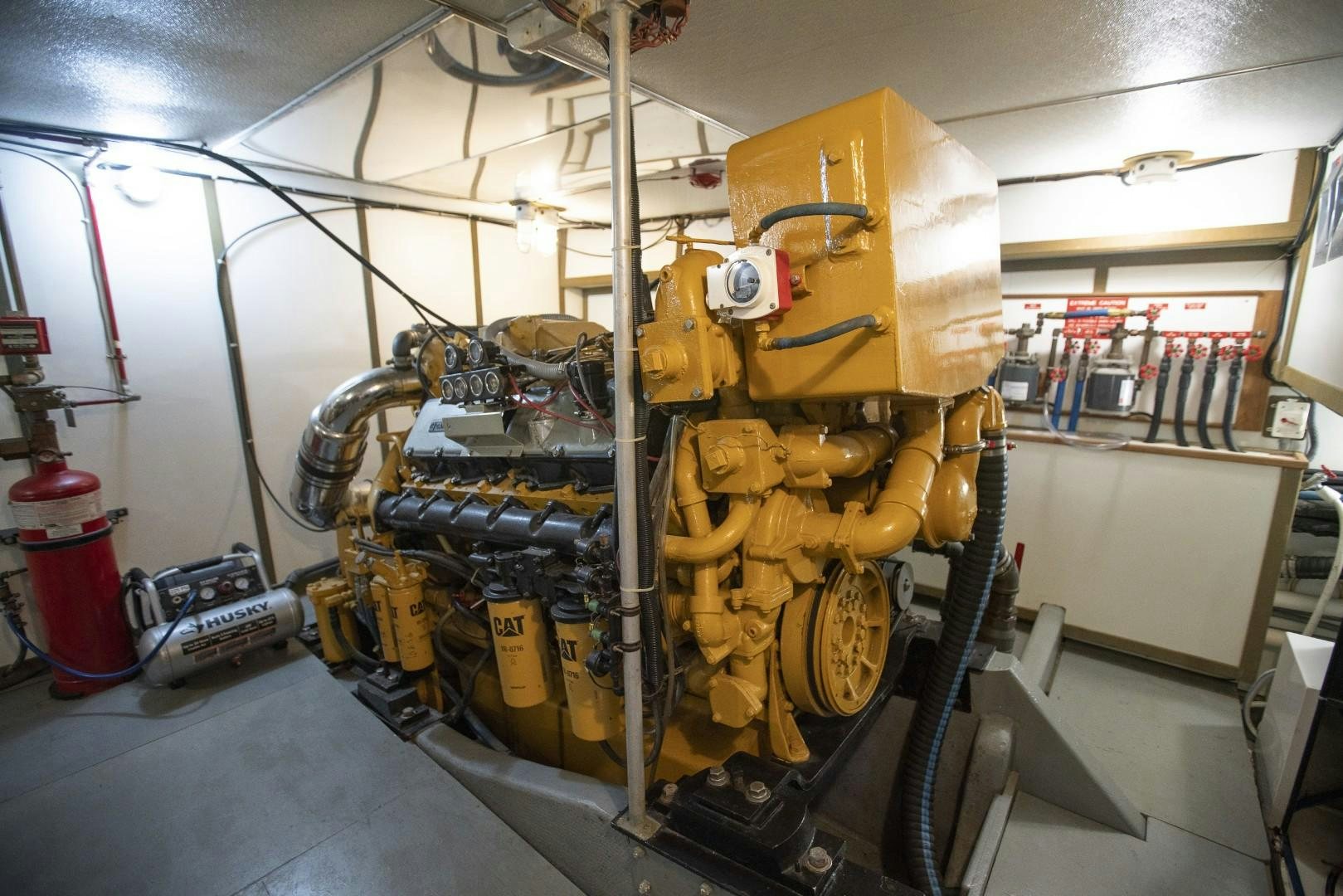 a large yellow machine in a factory aboard HEMINGWAY Yacht for Sale