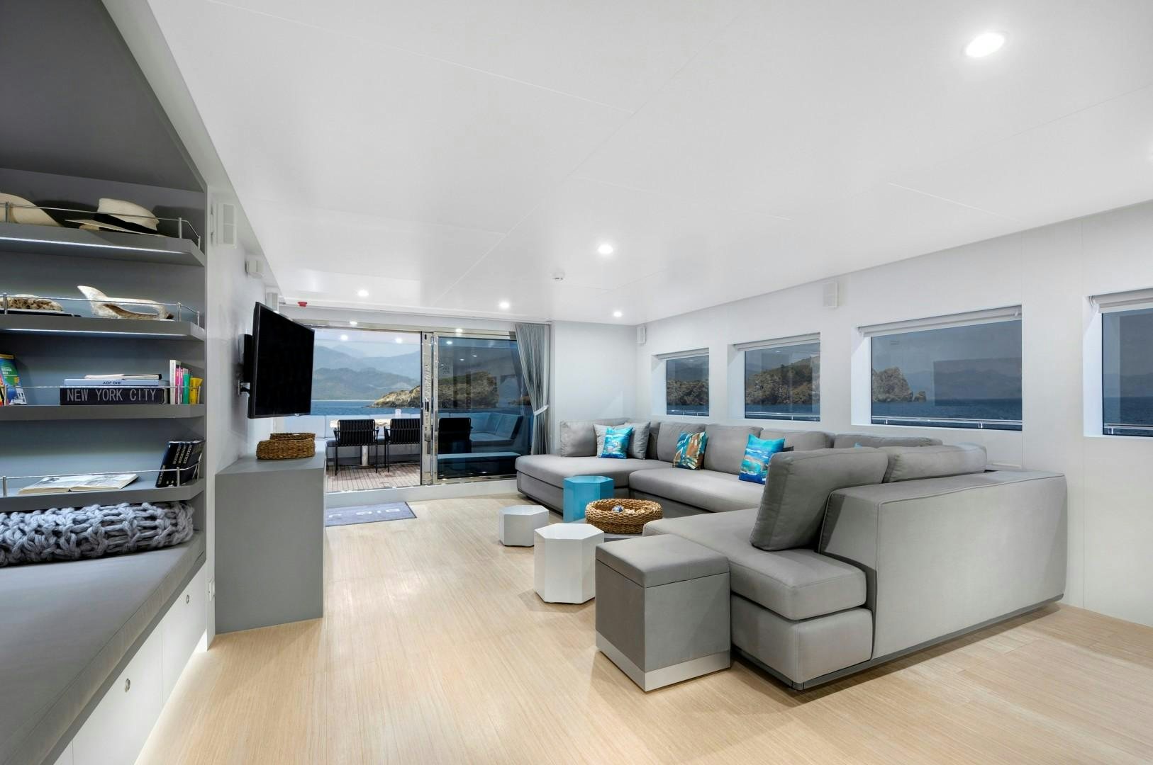 a living room with a large window aboard BIG JOY Yacht for Sale