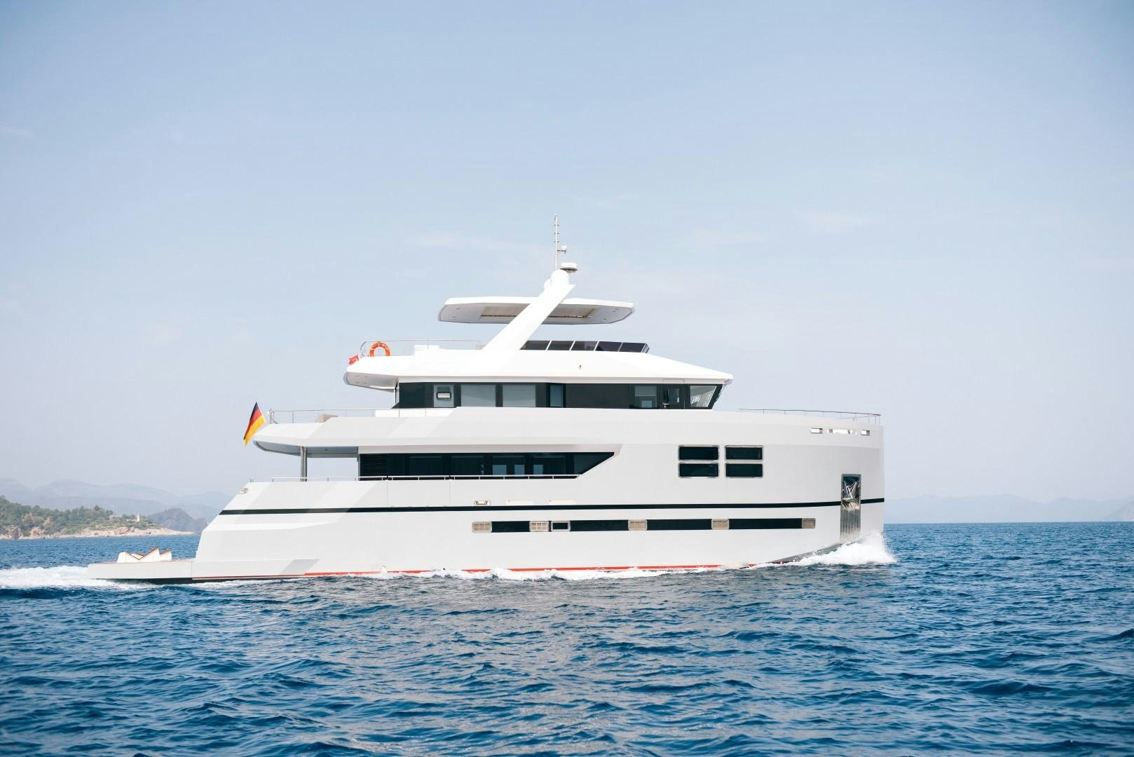 a white boat in the water aboard BIG JOY Yacht for Sale