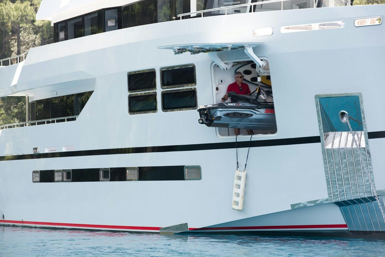 a boat with a person in it aboard BIG JOY Yacht for Sale
