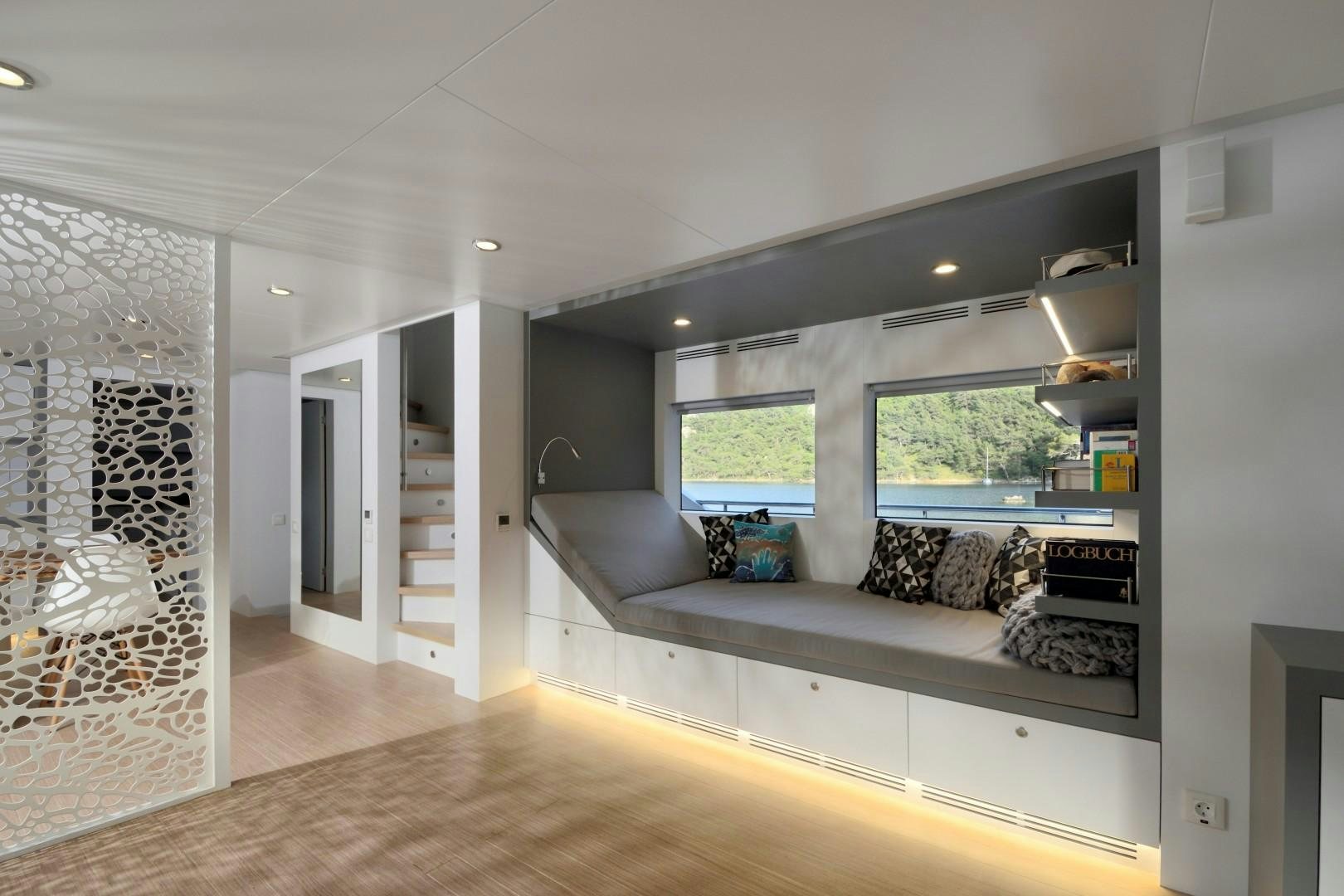 a living room with a large window aboard BIG JOY Yacht for Sale