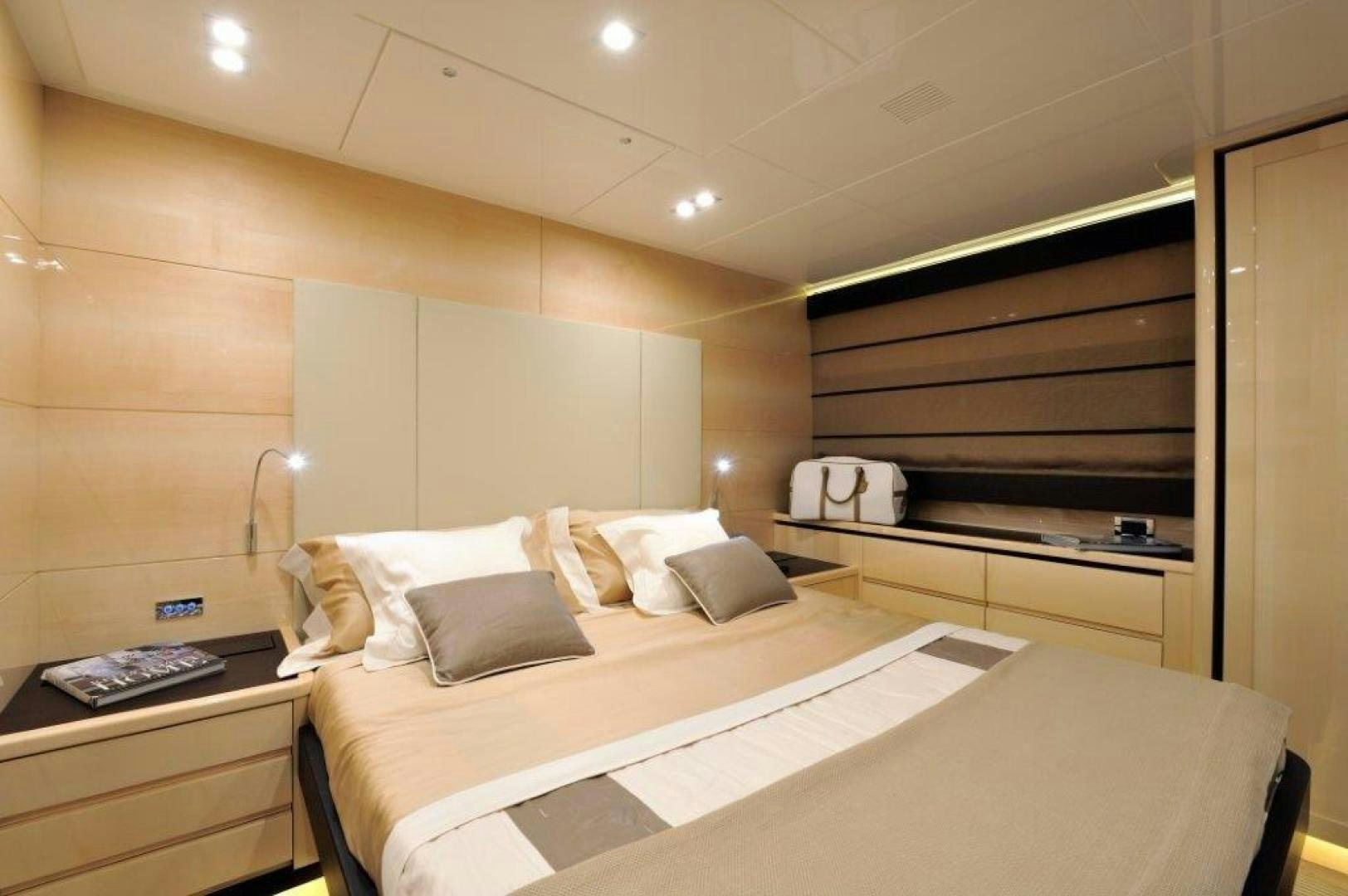 a room with a bed and a desk aboard ELLISIUM Yacht for Sale