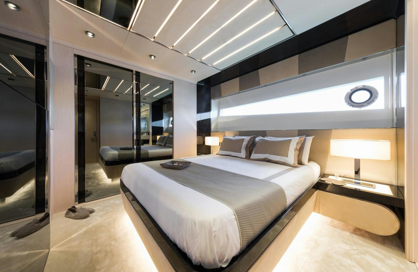 a room with a bed and a desk aboard KALLIENTE Yacht for Sale