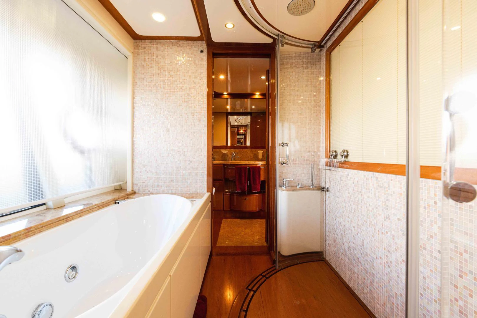 a bathroom with a tub and shower aboard KAVITA Yacht for Sale