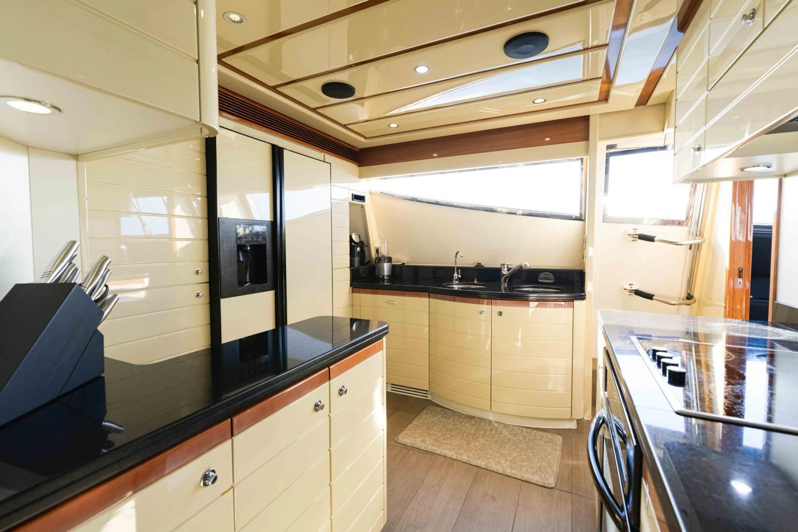 a kitchen with a large island aboard KAVITA Yacht for Sale