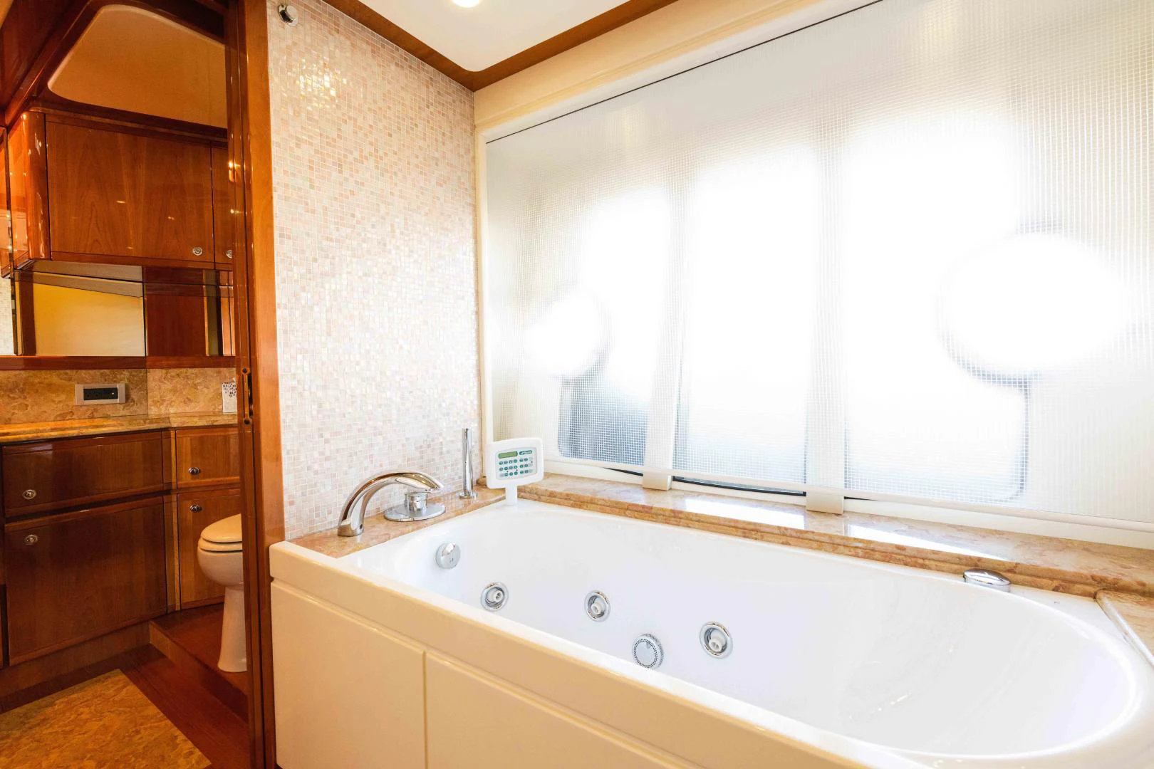 a bathroom with a bathtub and sink aboard KAVITA Yacht for Sale