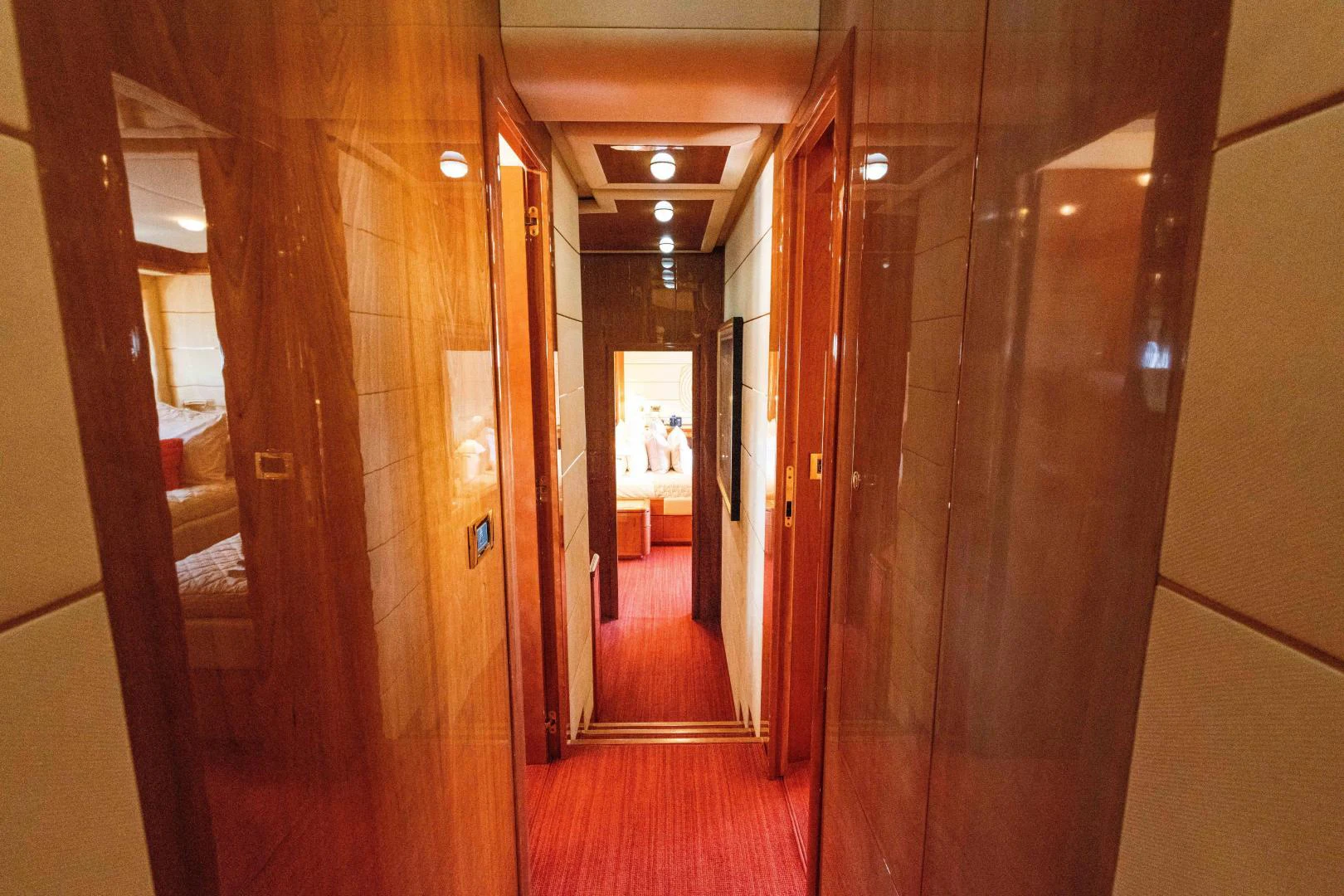a hallway with wooden doors aboard KAVITA Yacht for Sale