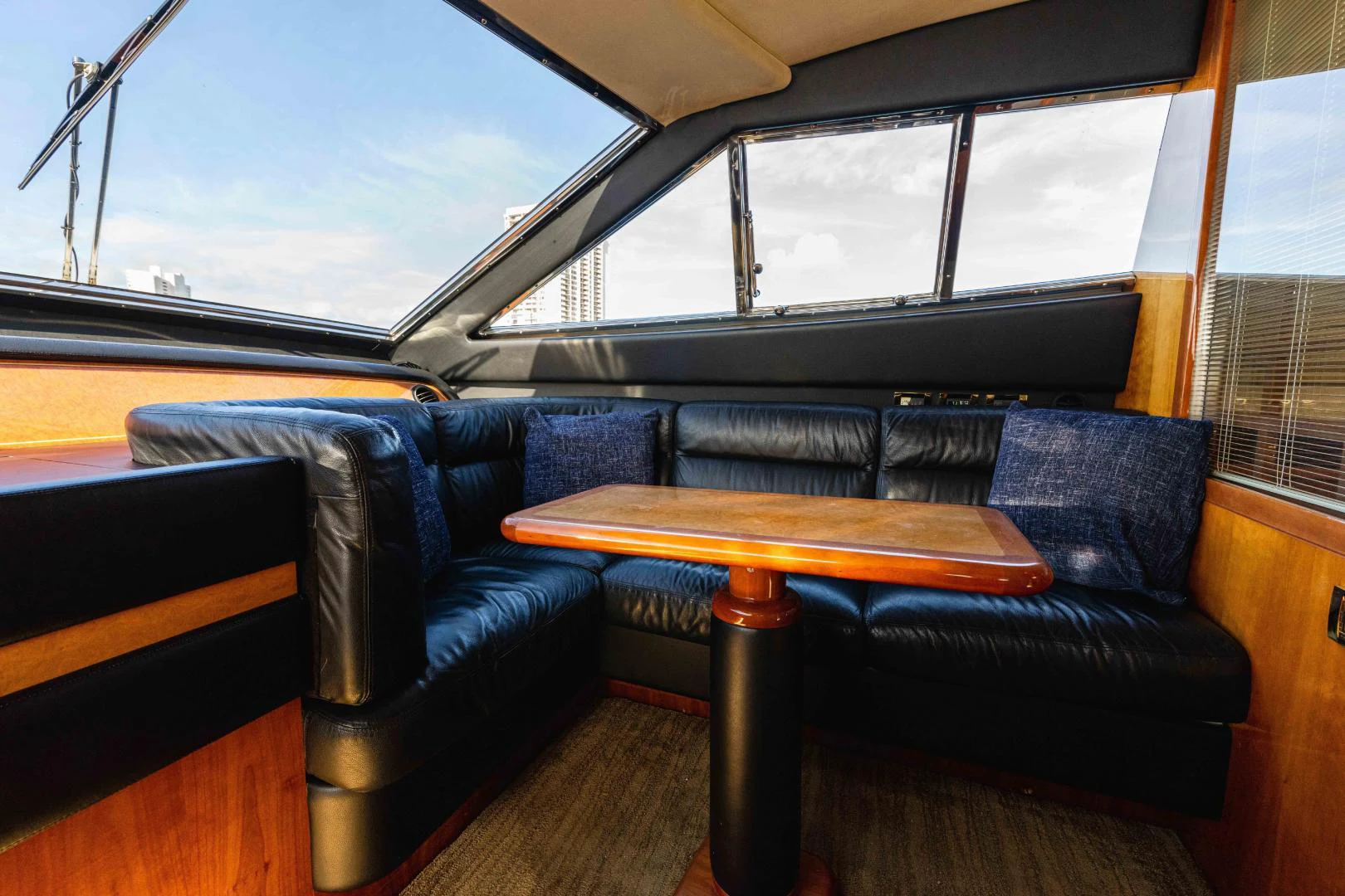 a couch and a table in a train aboard KAVITA Yacht for Sale