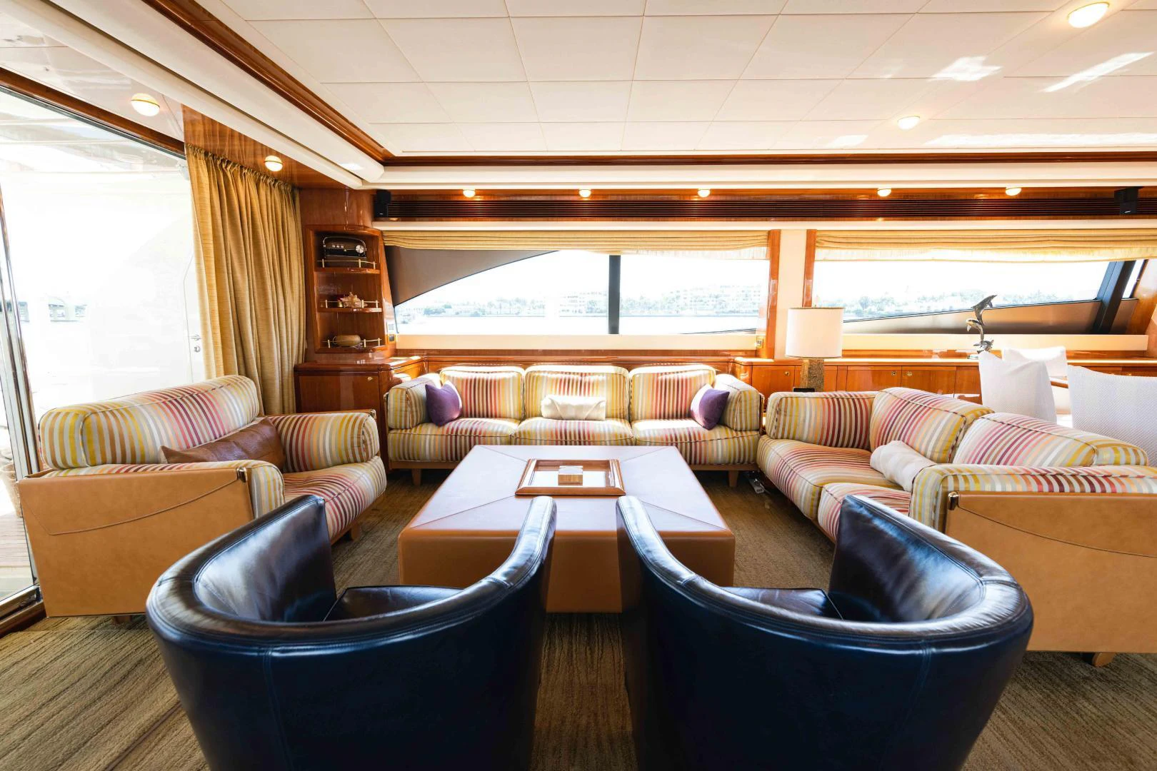 a living room with a large window aboard KAVITA Yacht for Sale