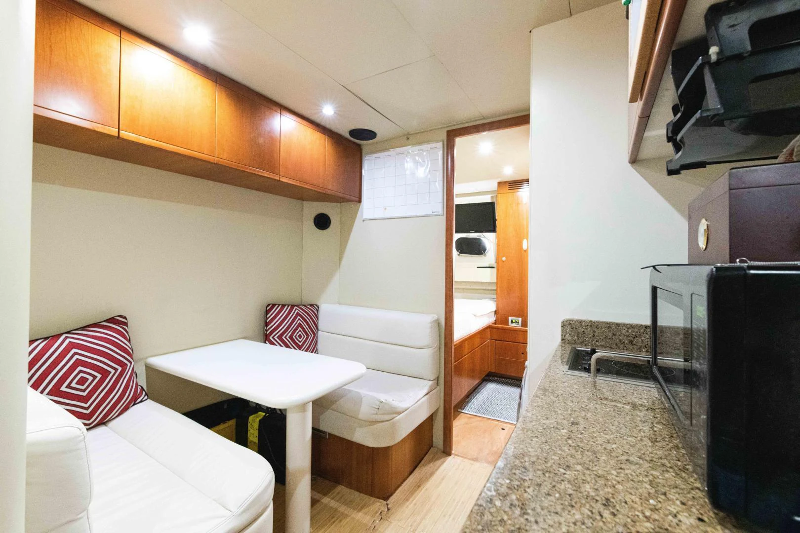a living room with a couch and a television aboard KAVITA Yacht for Sale