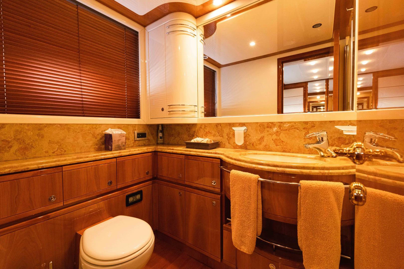 a bathroom with wooden cabinets aboard KAVITA Yacht for Sale